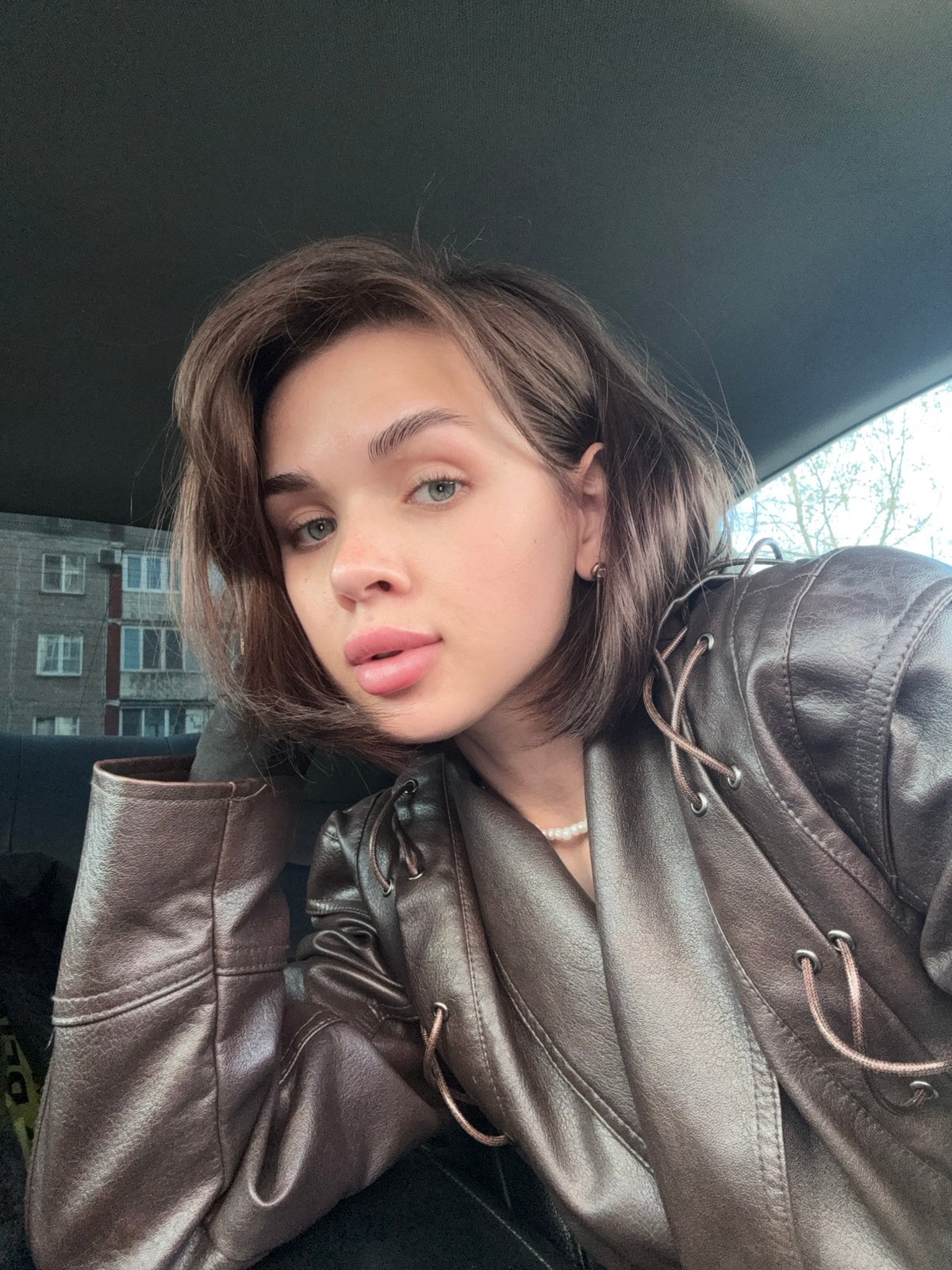 Woman photographed at multiple locations in Perm during afternoon