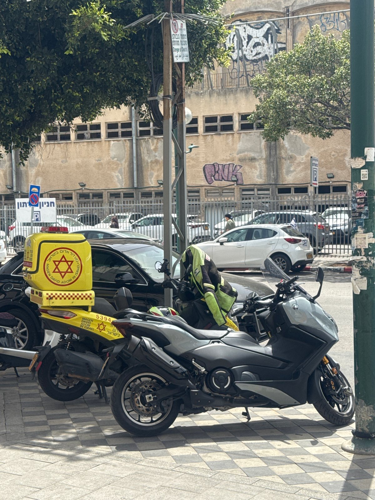 Scooter parked on sidewalk in Netanya street scene