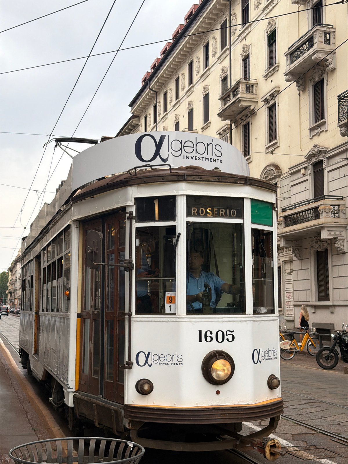Milan tram 1605 rolls through a mix of old and new streetscapes