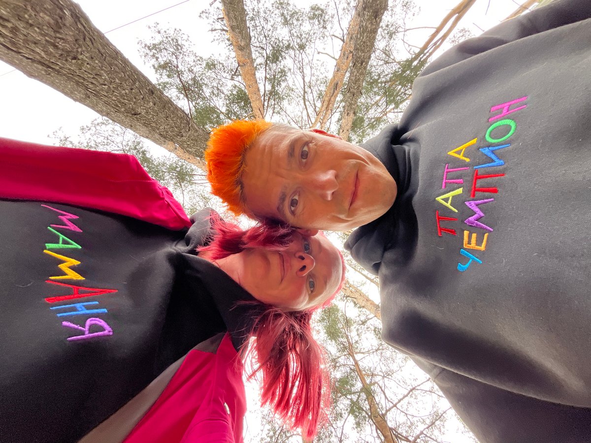 Colorful-haired individuals photographed in Chaikovsky forest gathering