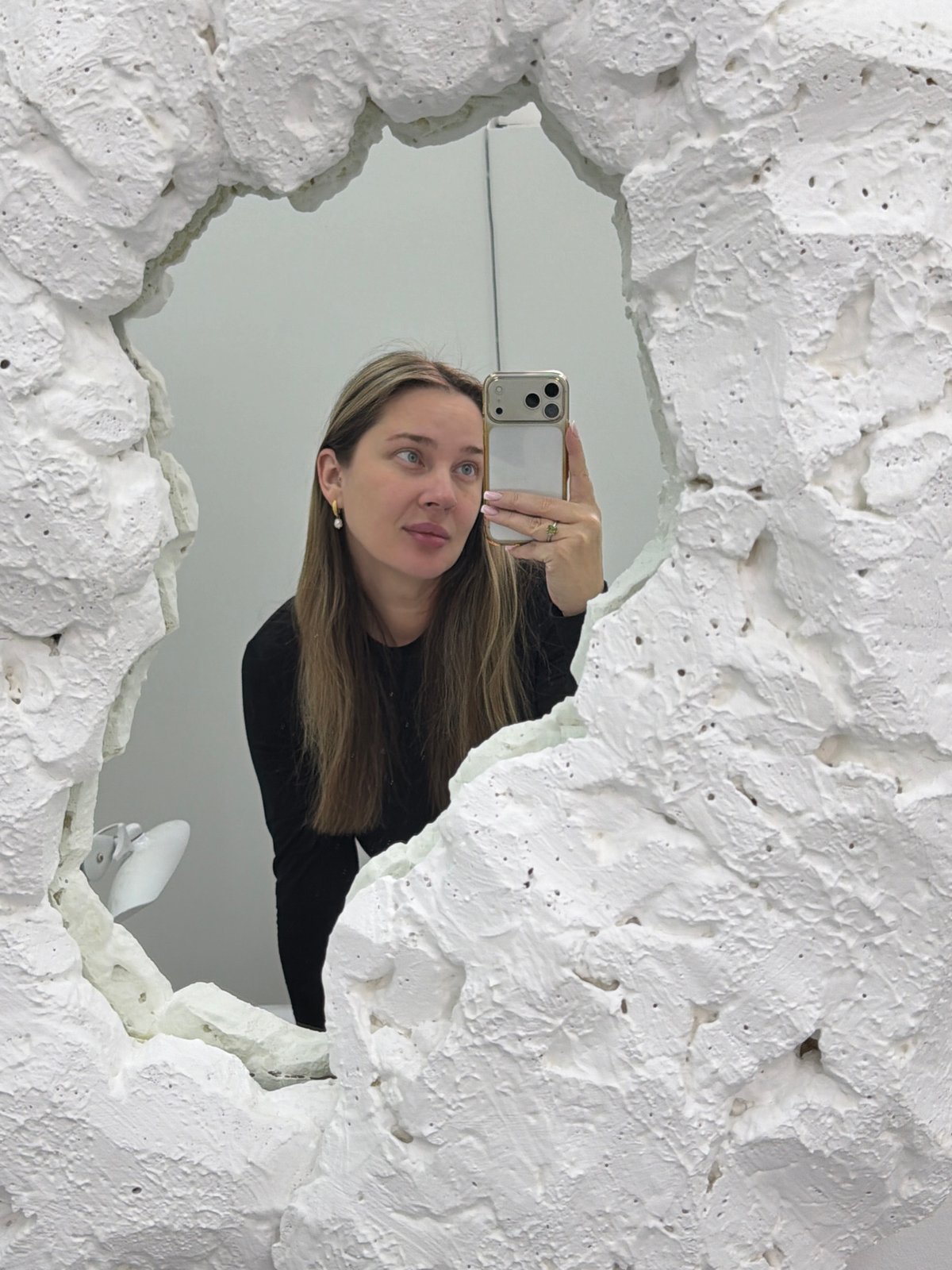 Woman takes morning selfies with iPhone in Moscow