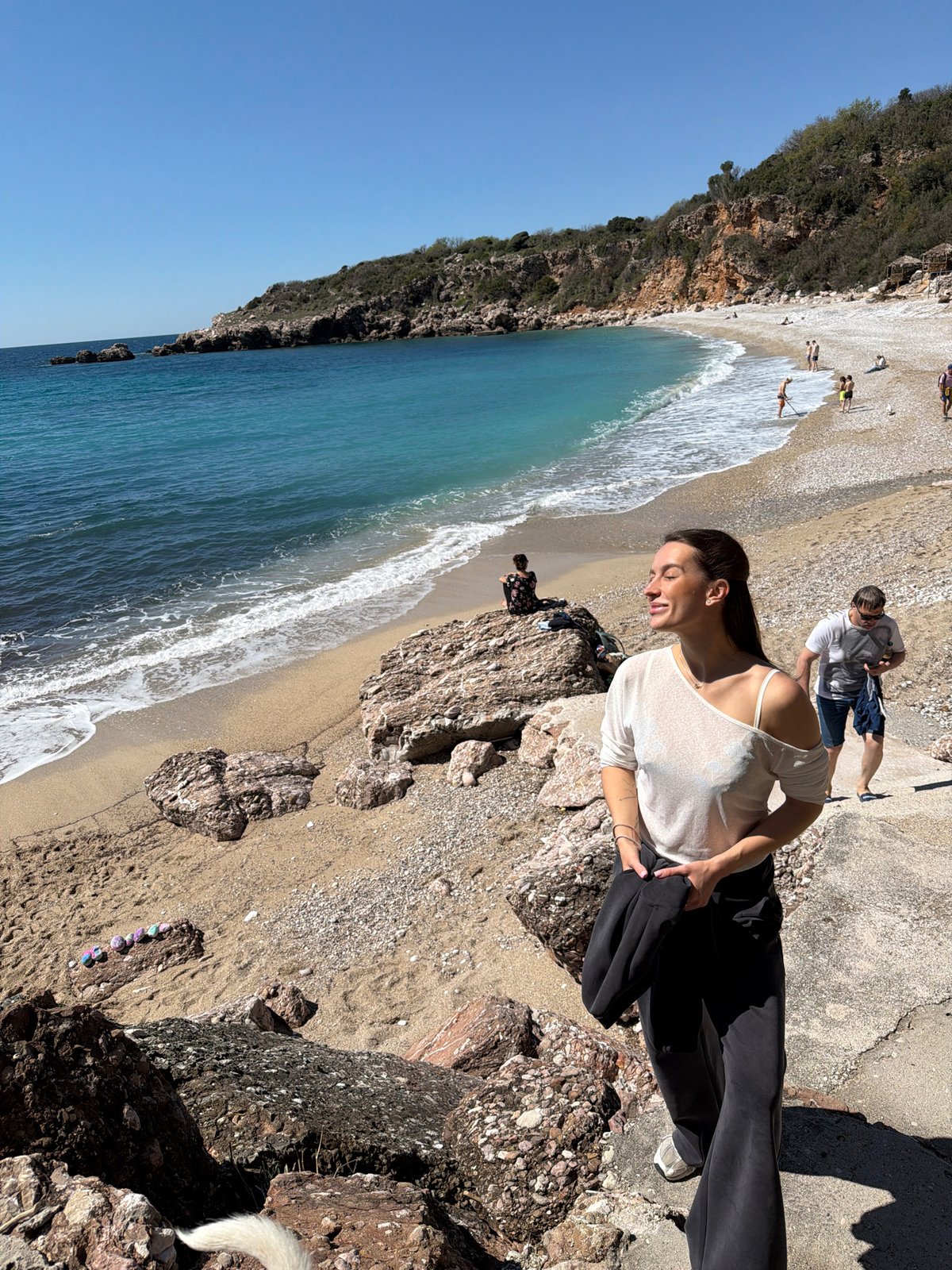 Beach visitors enjoy sunny morning at Drobnići, Montenegro coast