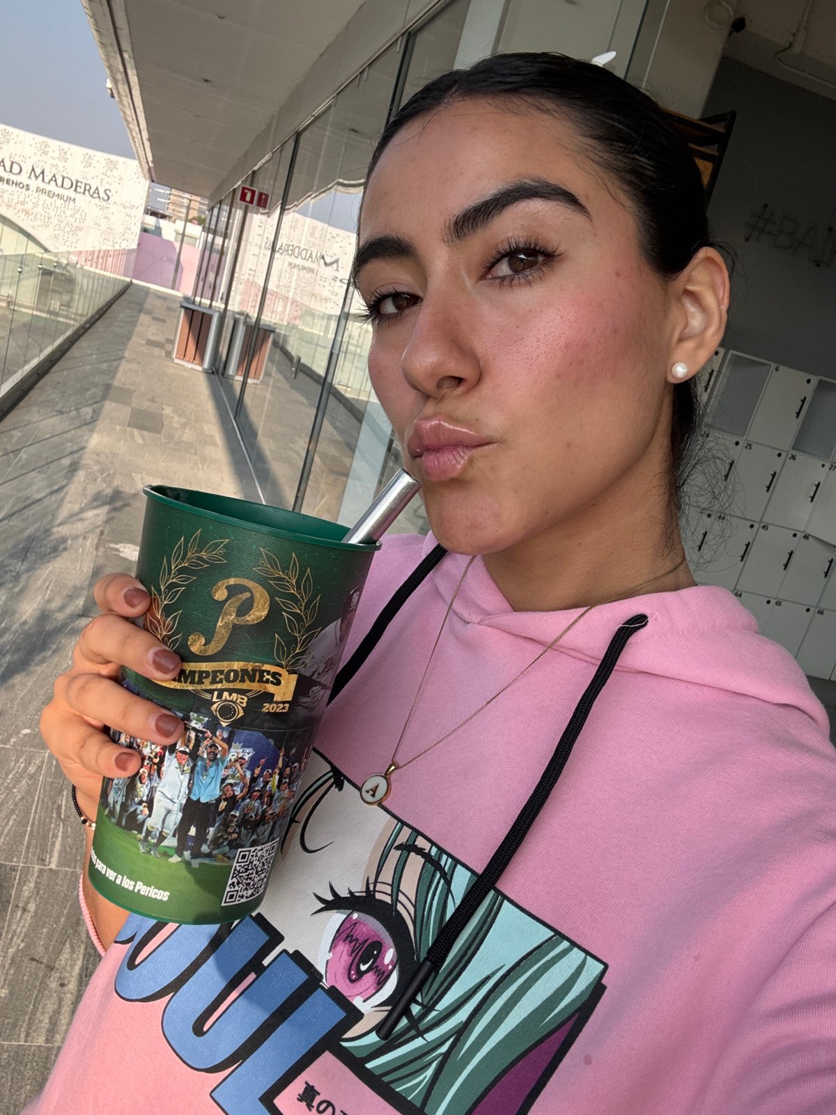 Woman displays Pericos championship cup in Puebla selfie
