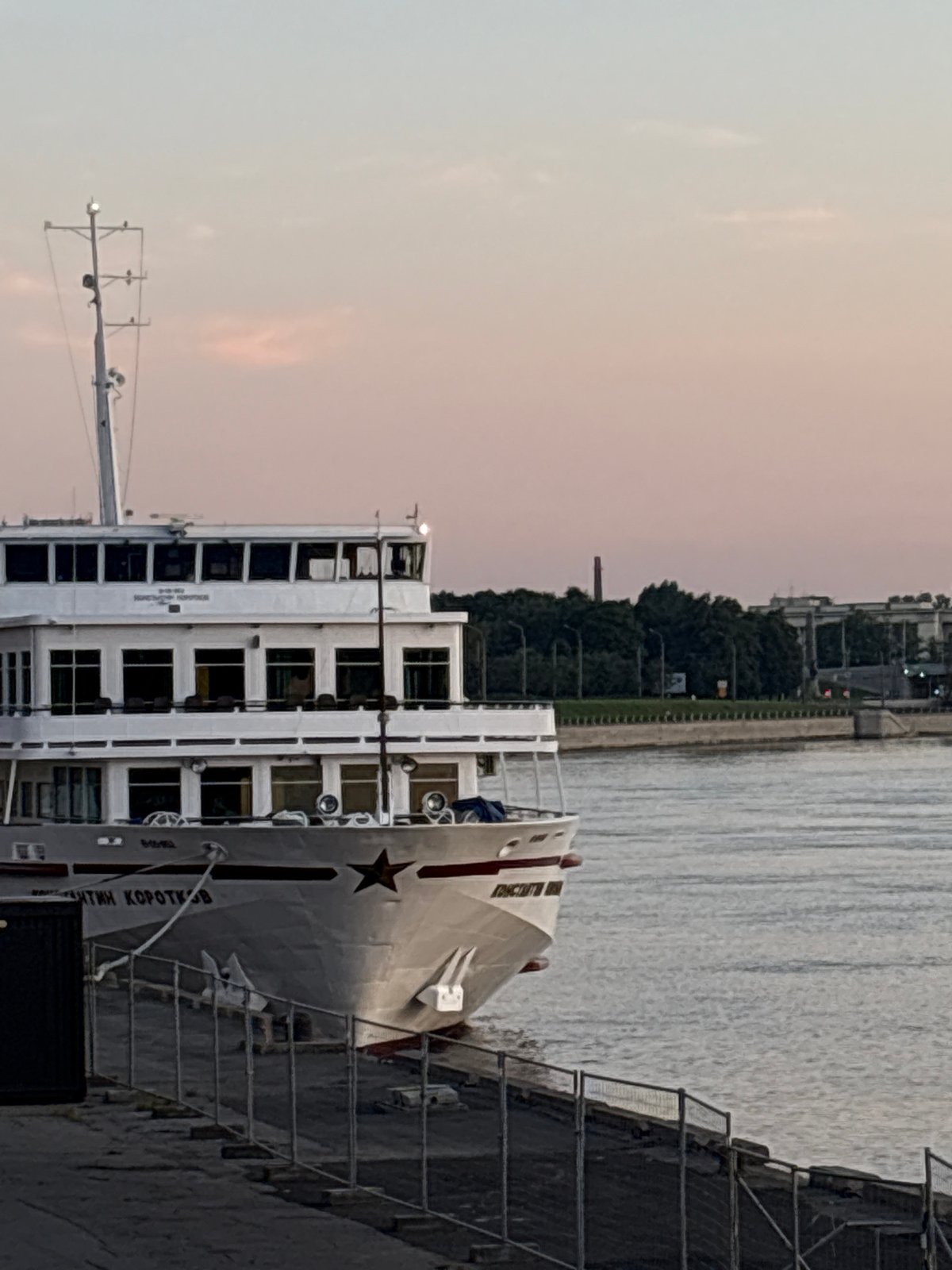 Bicycle ride and docked ship along the Neva at twilight
