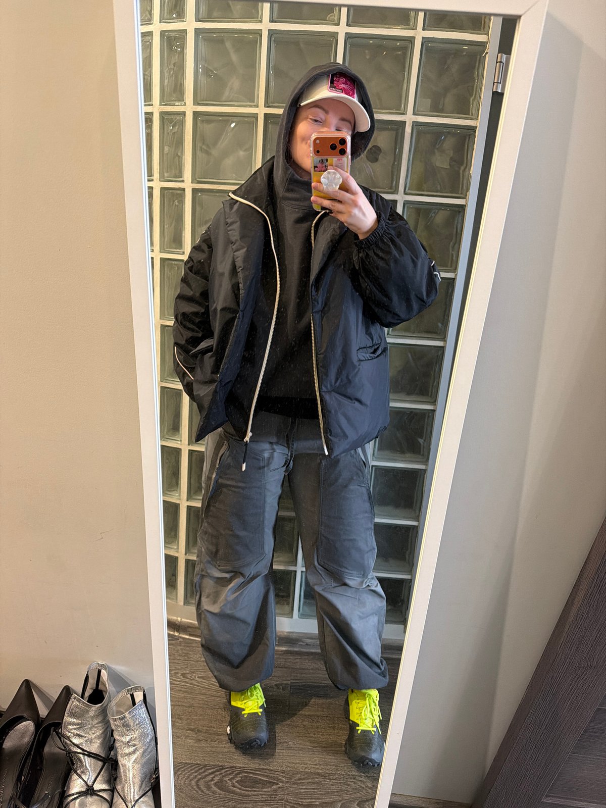 Person takes mirror selfie in Moscow apartment