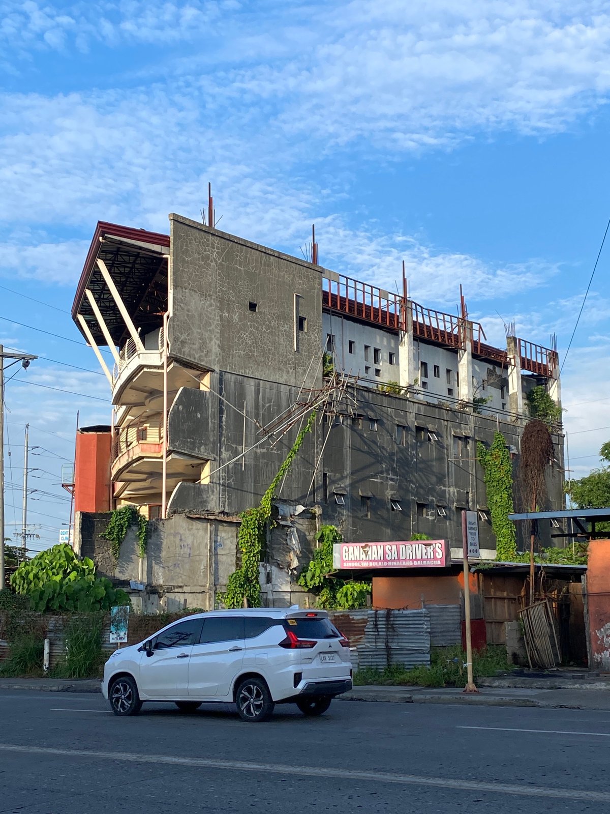 Street-level afternoon scenes along a busy Davao City road