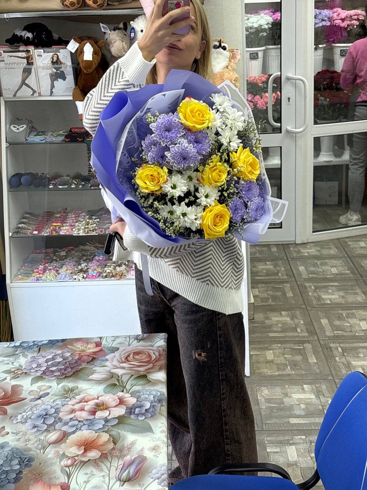 Yellow roses and chrysanthemums at a Ust-Ilimsk flower shop
