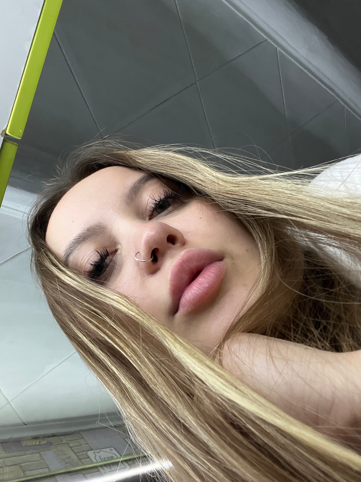 Young woman observed in inverted portraits in Port-Katon, Russia