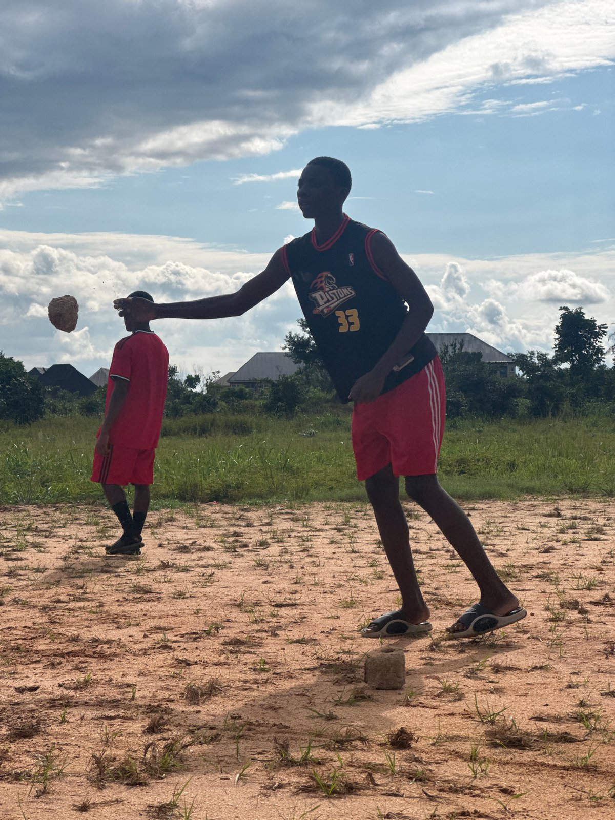 Pickup football on a dusty field in Ihiagwa, Nigeria