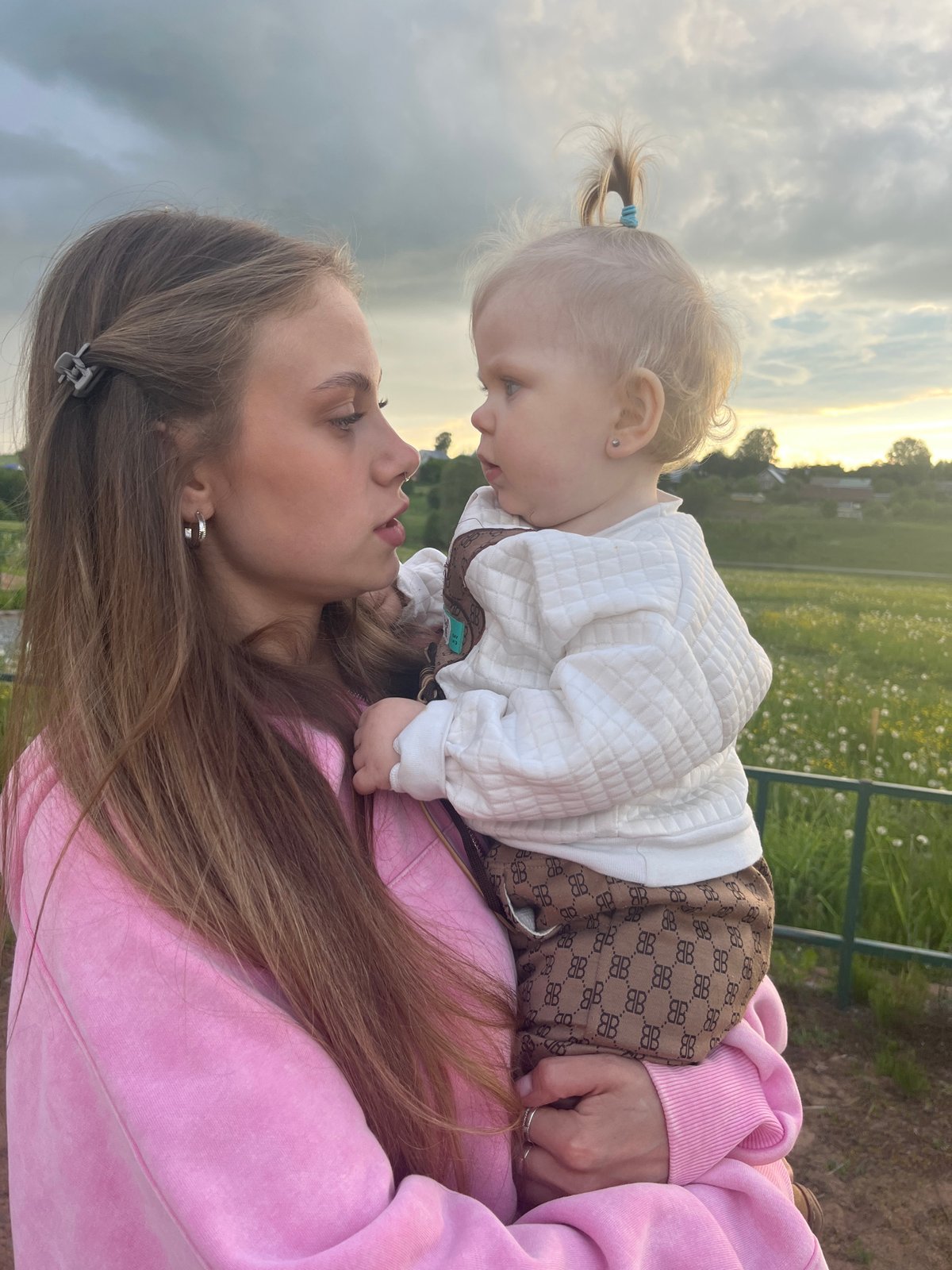 Family enjoys afternoon outing at playground and lake in Фоки