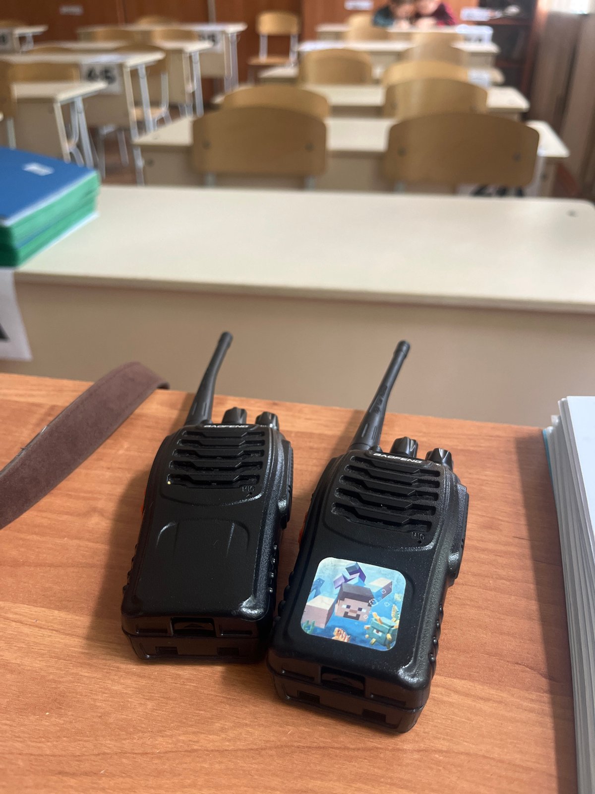 Woman takes exam in Kaspiysk classroom with walkie-talkies present