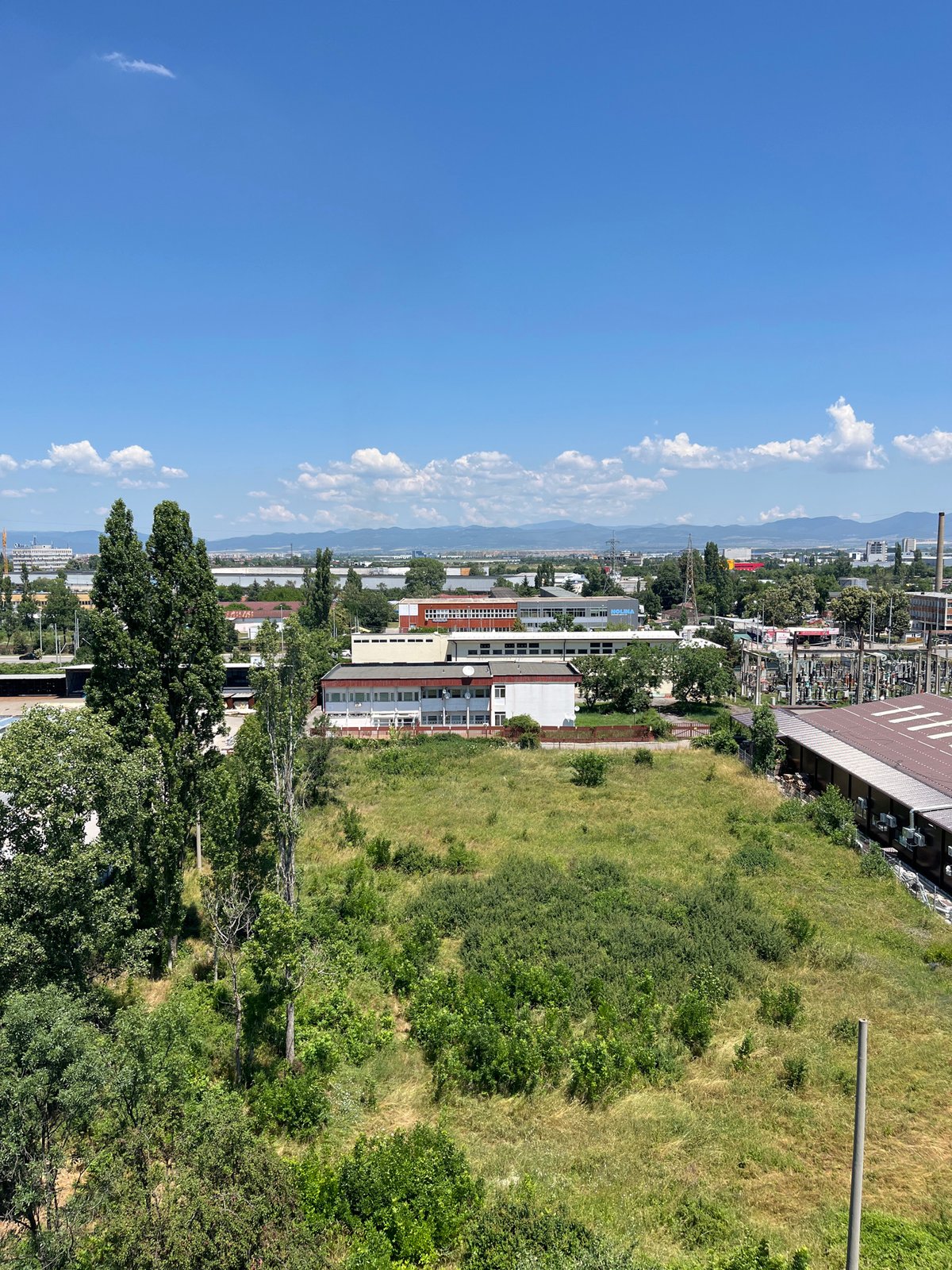 Aerial and hillside views across Sofia's urban-industrial edge