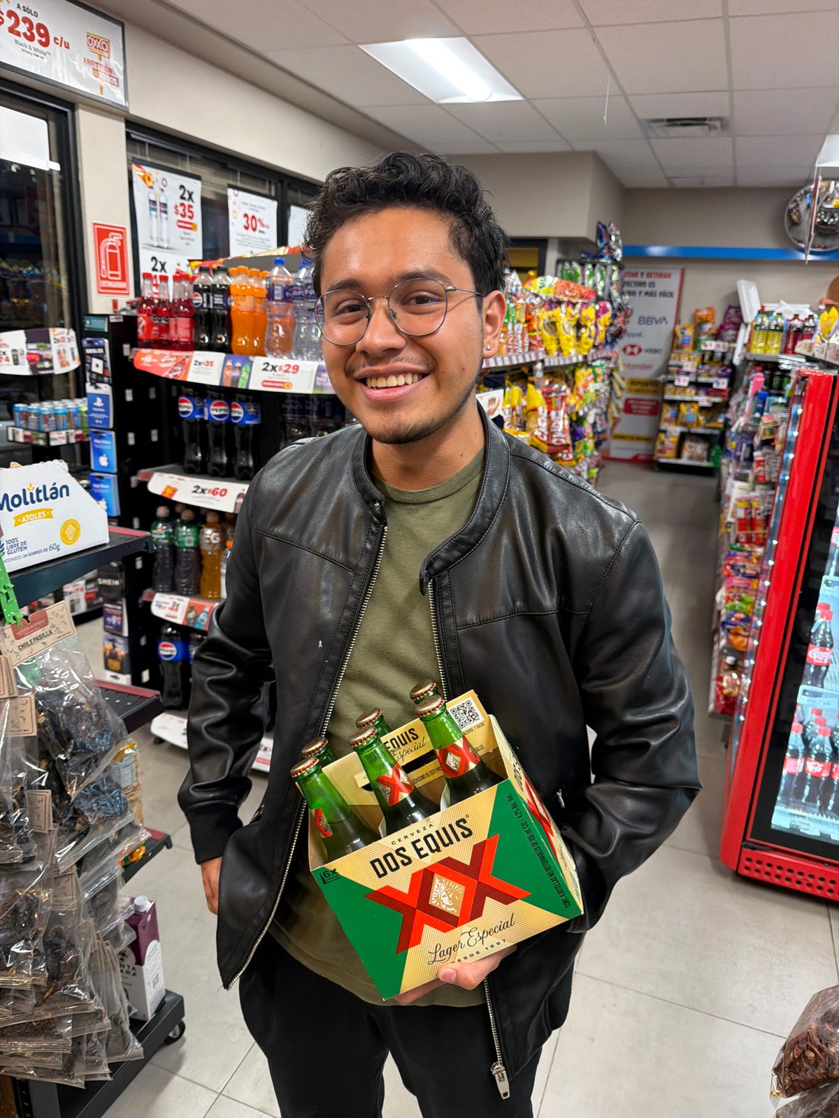 Man buys beer at OXXO convenience store in Cholula