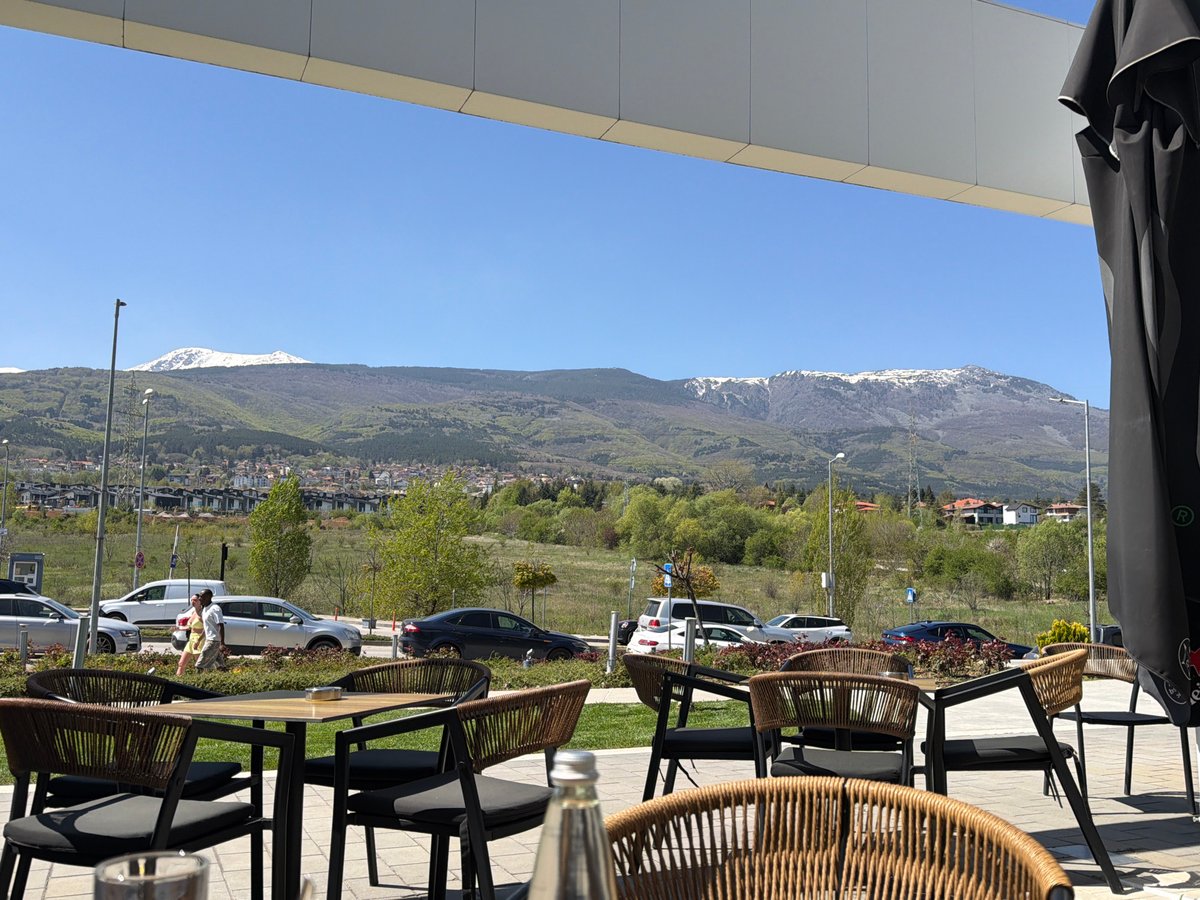 Morning cafe scene captured with mountain views in Sofia