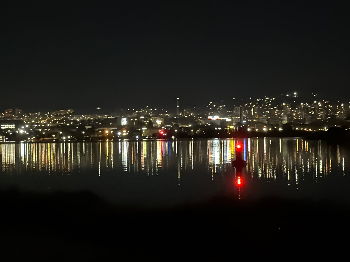 Varna's night skyline reflected in water captured by witness