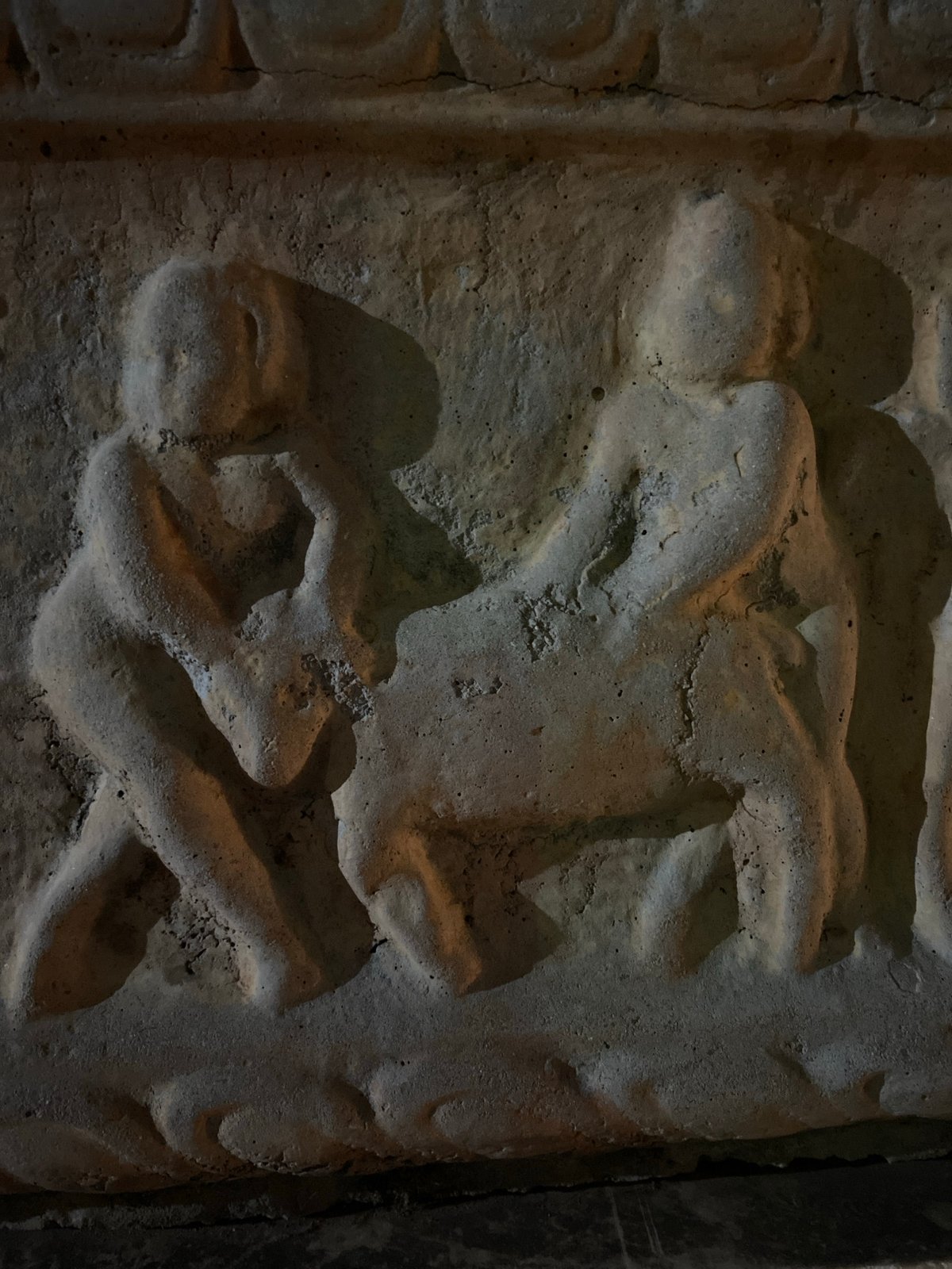 Tourist documents ancient carvings and city views in Budva