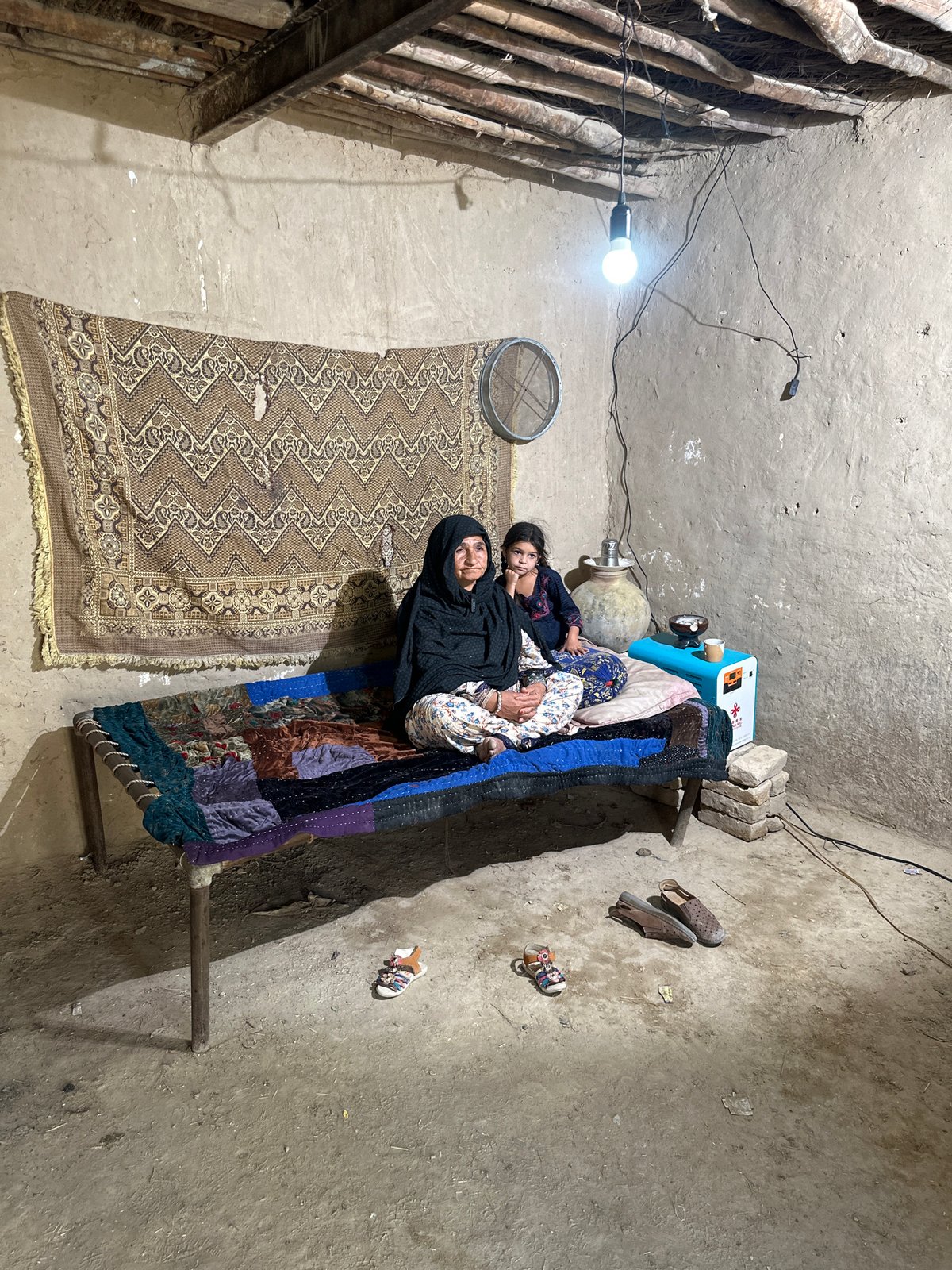 Elderly woman rests at home in Quetta dwelling