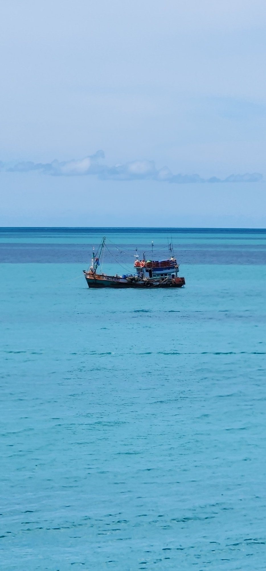 Rocky coastline and calm water at Baan Chaweng Noi, Koh Samui