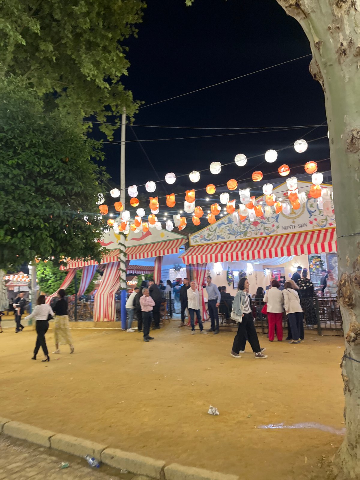 Nighttime Feria de Abril celebrations documented in Seville streets