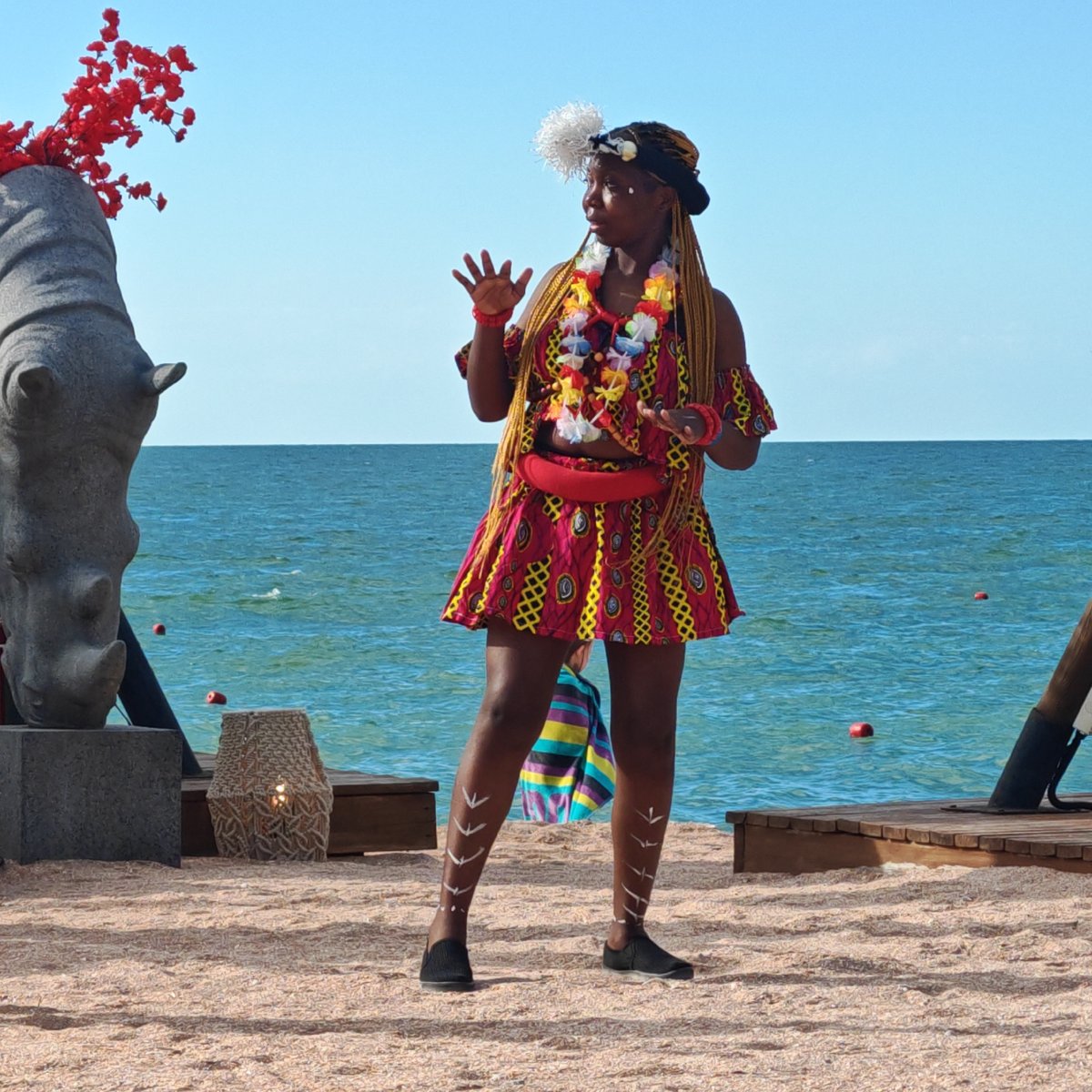 Beach resort day: pool games, drum performances, and open-air leisure