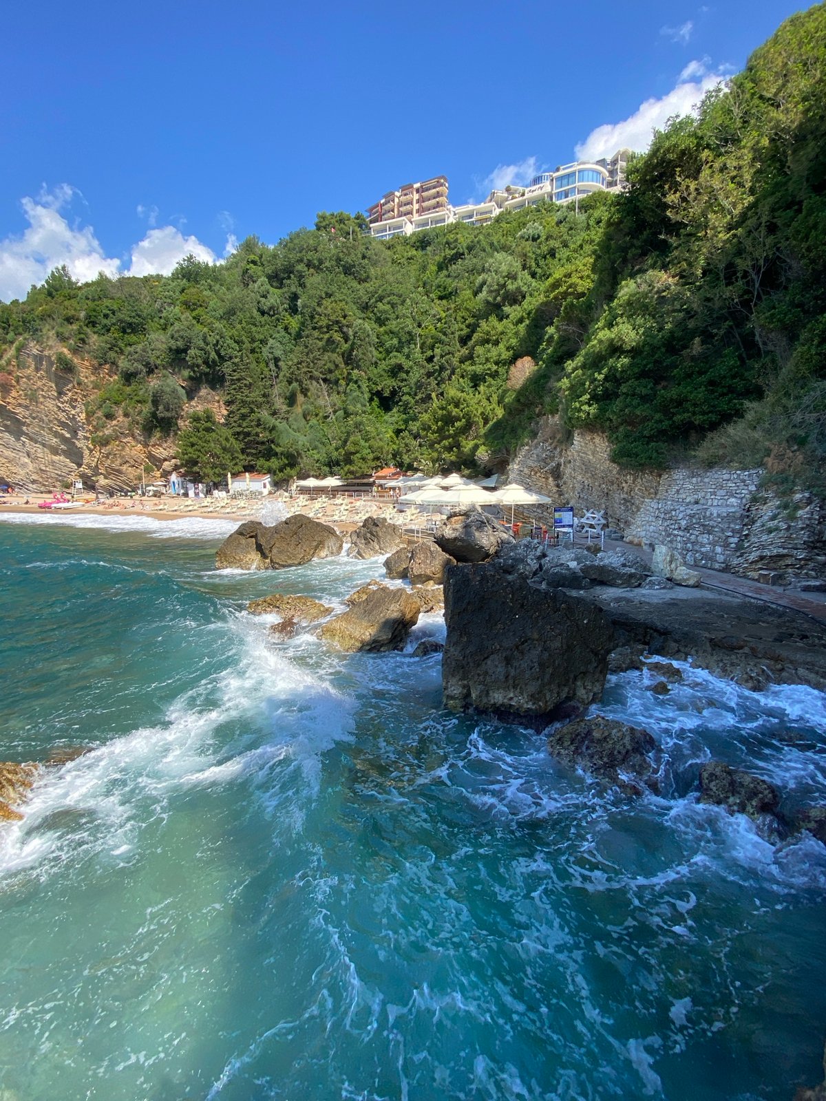 Clear morning skies over Budva's green coastline documented