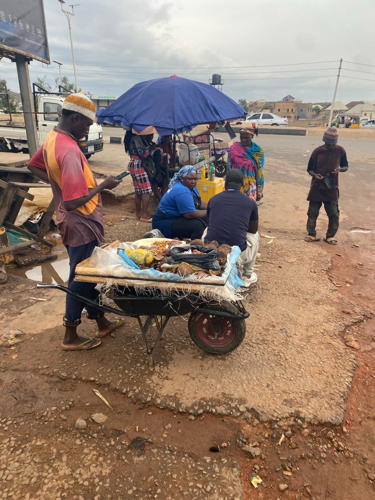 Street vendors and pedestrians captured in Gura Top Nigeria