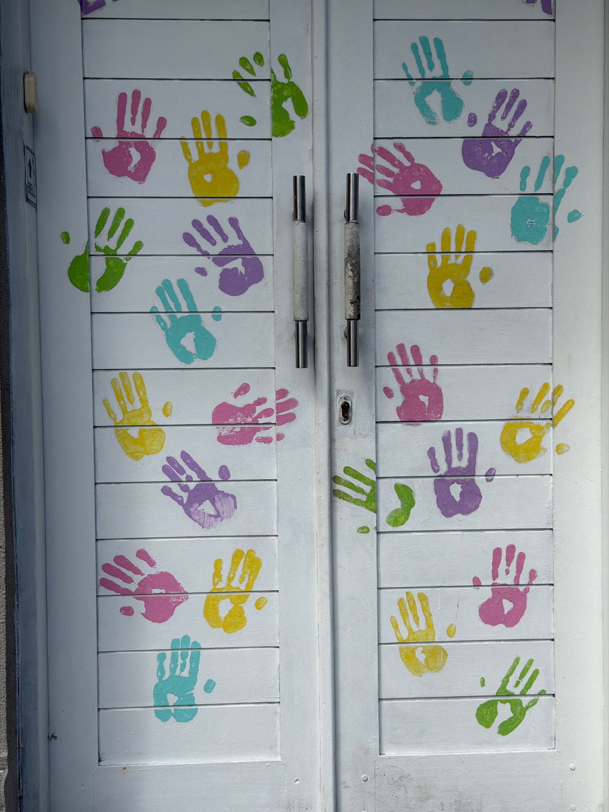 Children's playtime and artwork documented at Kuta facility