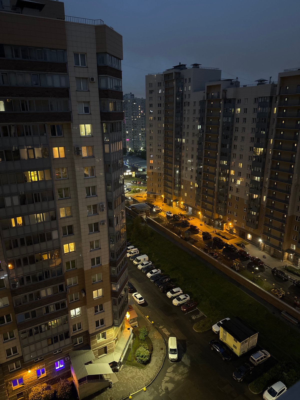Evening view of illuminated apartment buildings in Russia