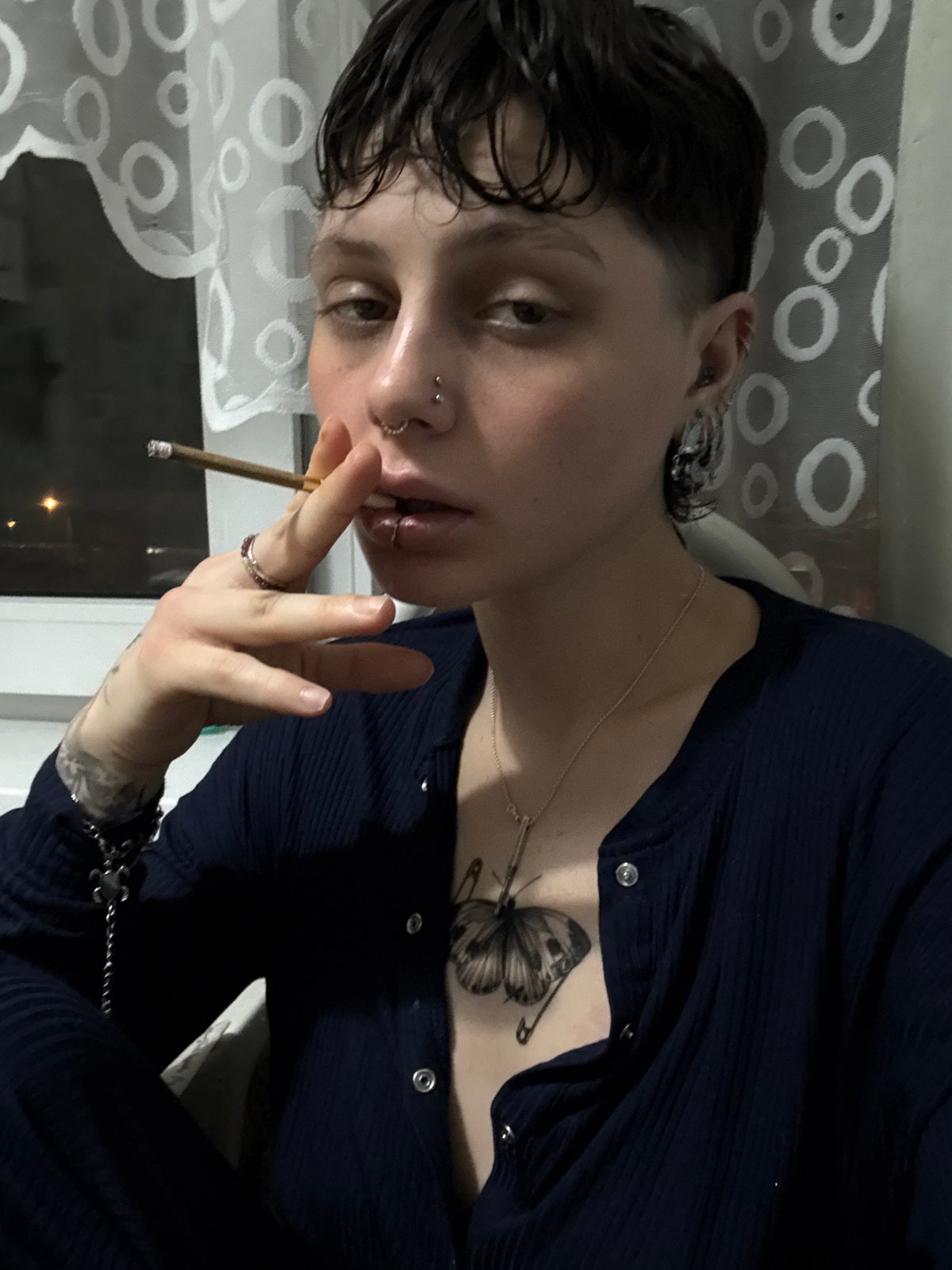 Person smoking cigarette observed in Saint Petersburg late night