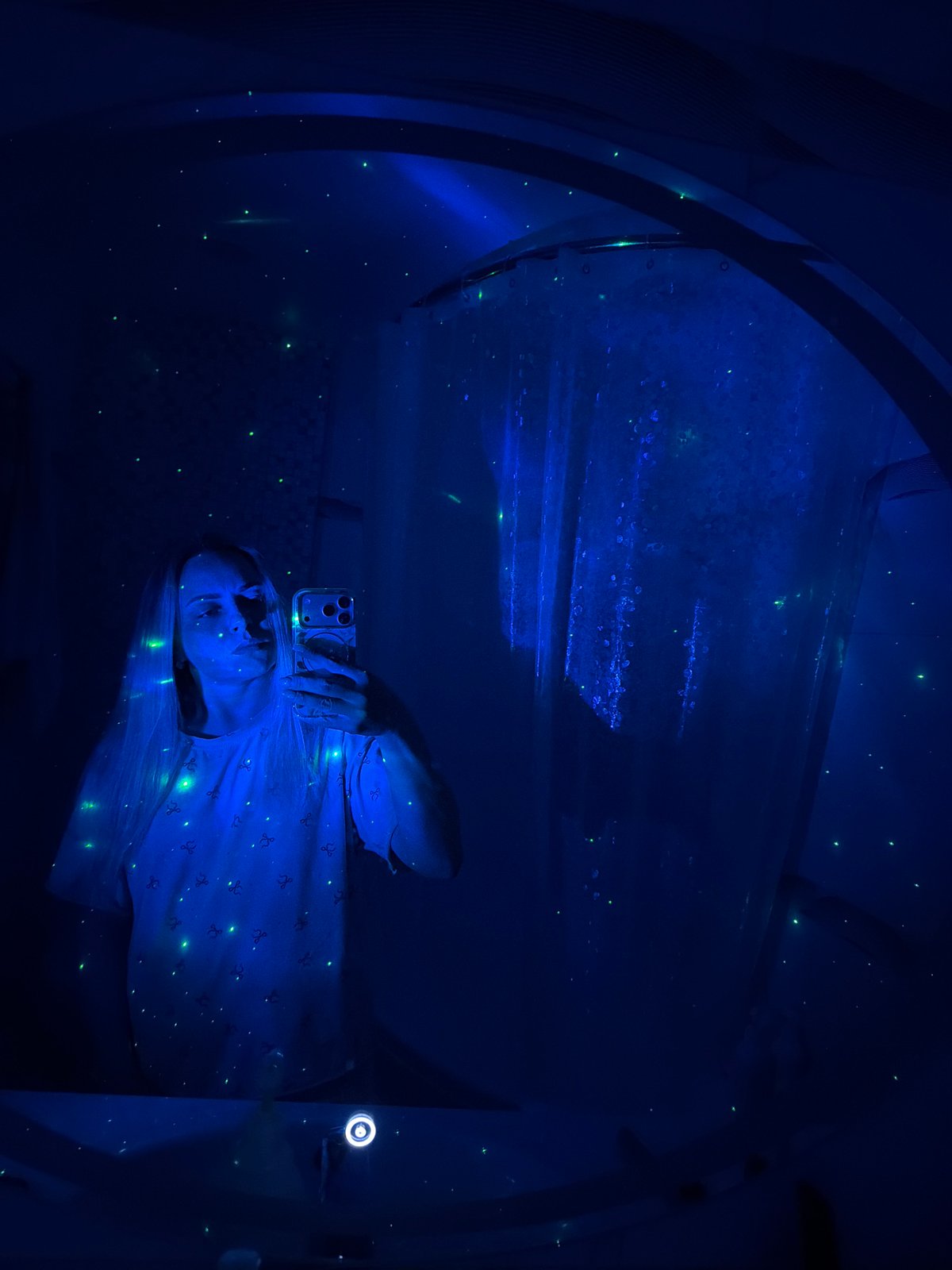 Woman takes colorful selfies in bathroom in Votkinsk, Russia