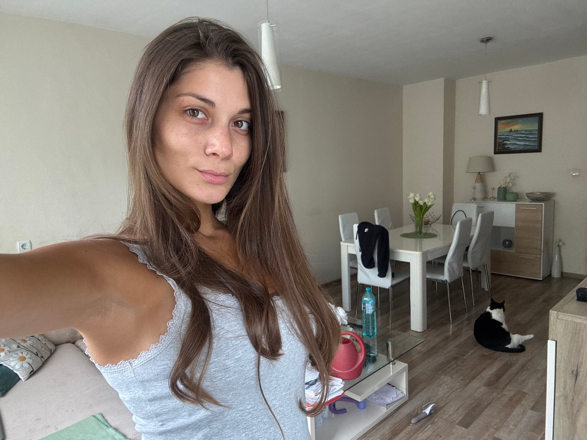 Woman shares morning routine with cat in Burgas apartment