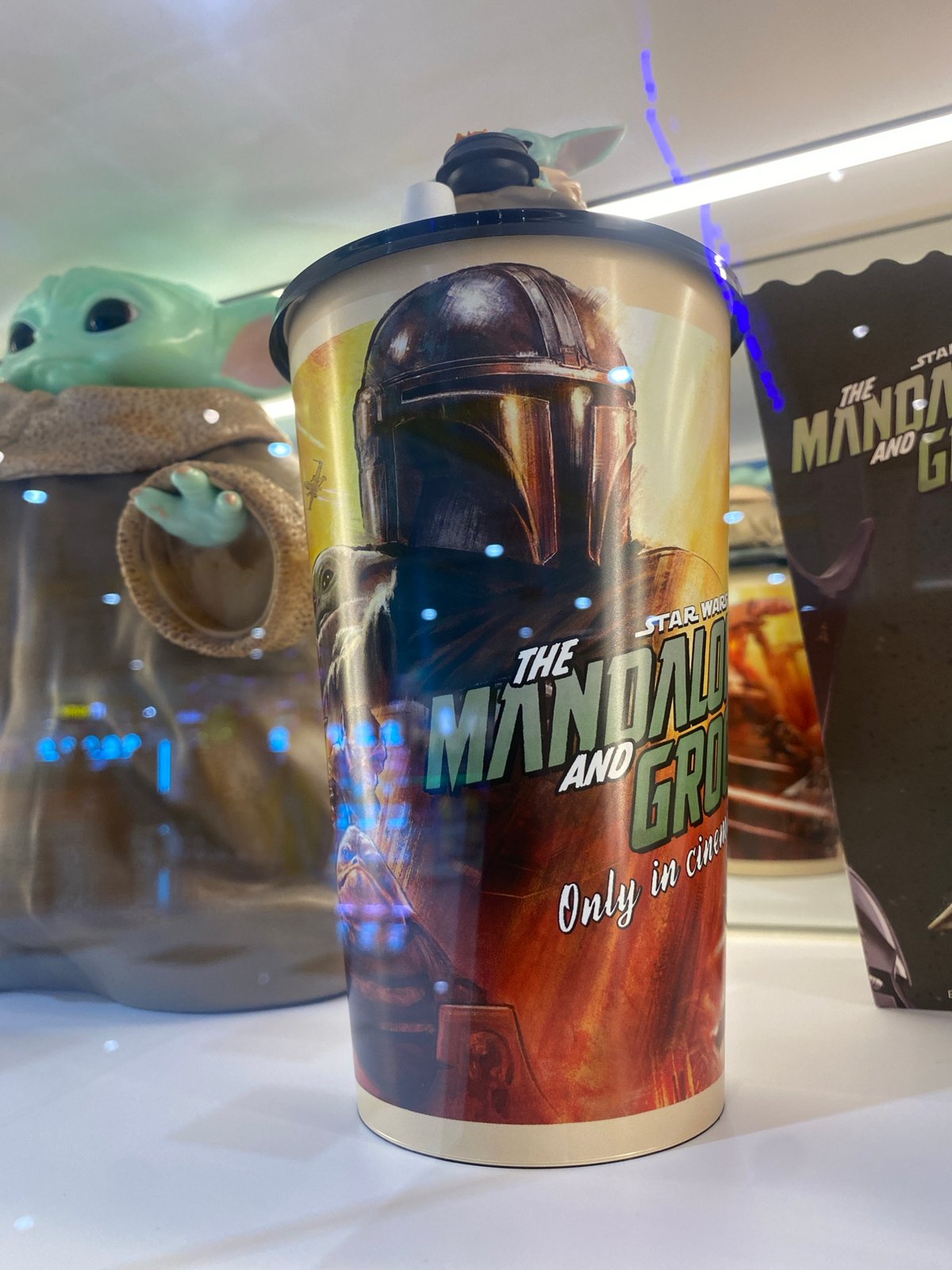 Pop culture merchandise displays documented at Thai entertainment venue