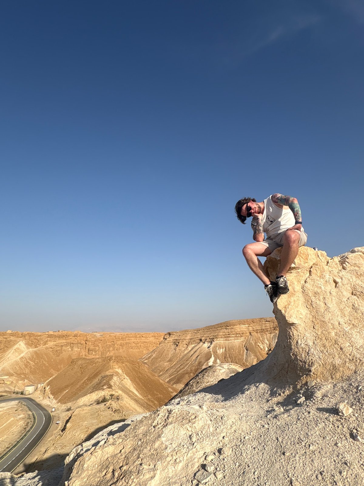Man hangs upside down from cliff in Arad desert
