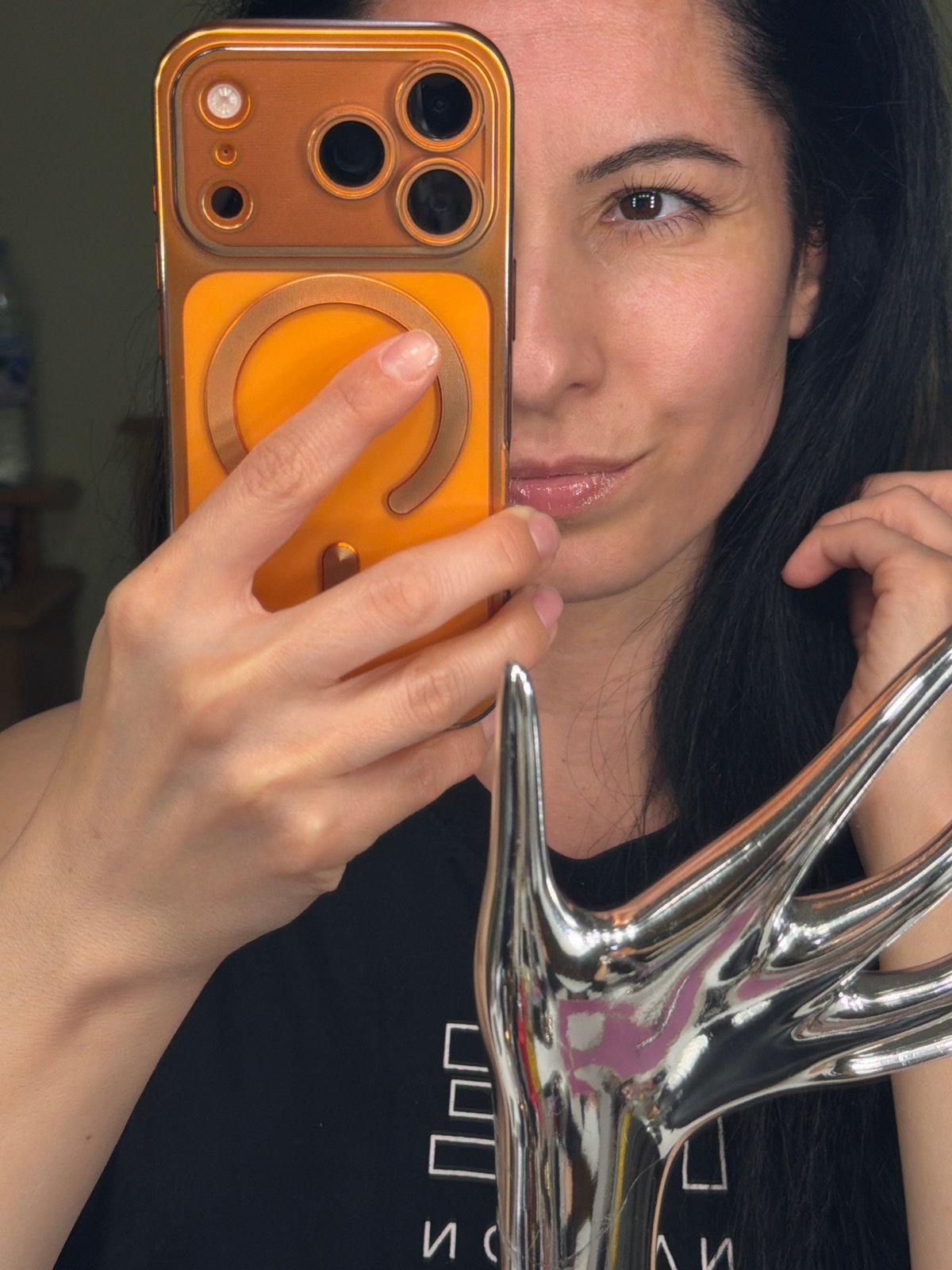 Woman takes selfie with decorative antler object in Pleven