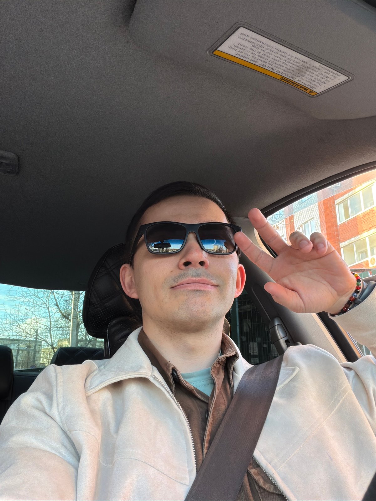 Man takes selfies in car during daytime in Izhevsk