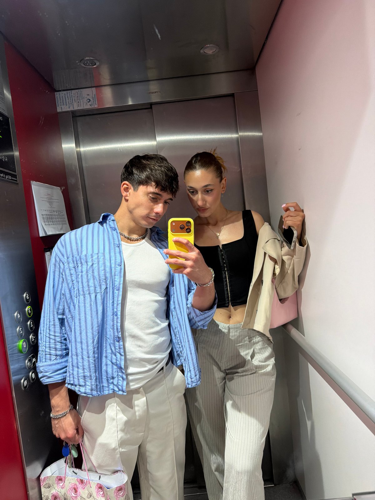 Couple Takes Mirror Selfie in Sofia Elevator