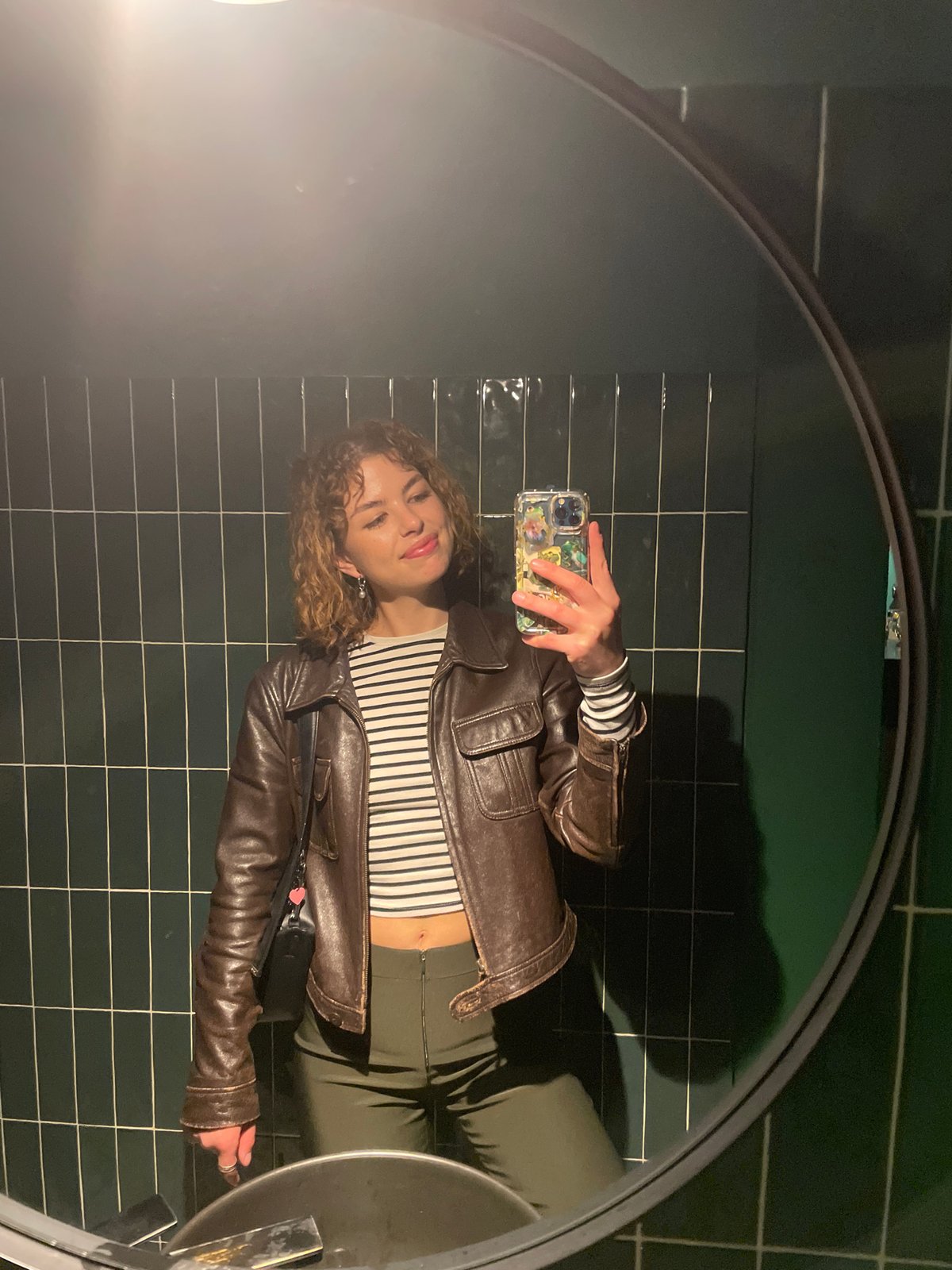 Woman takes mirror selfie in Budva, Montenegro