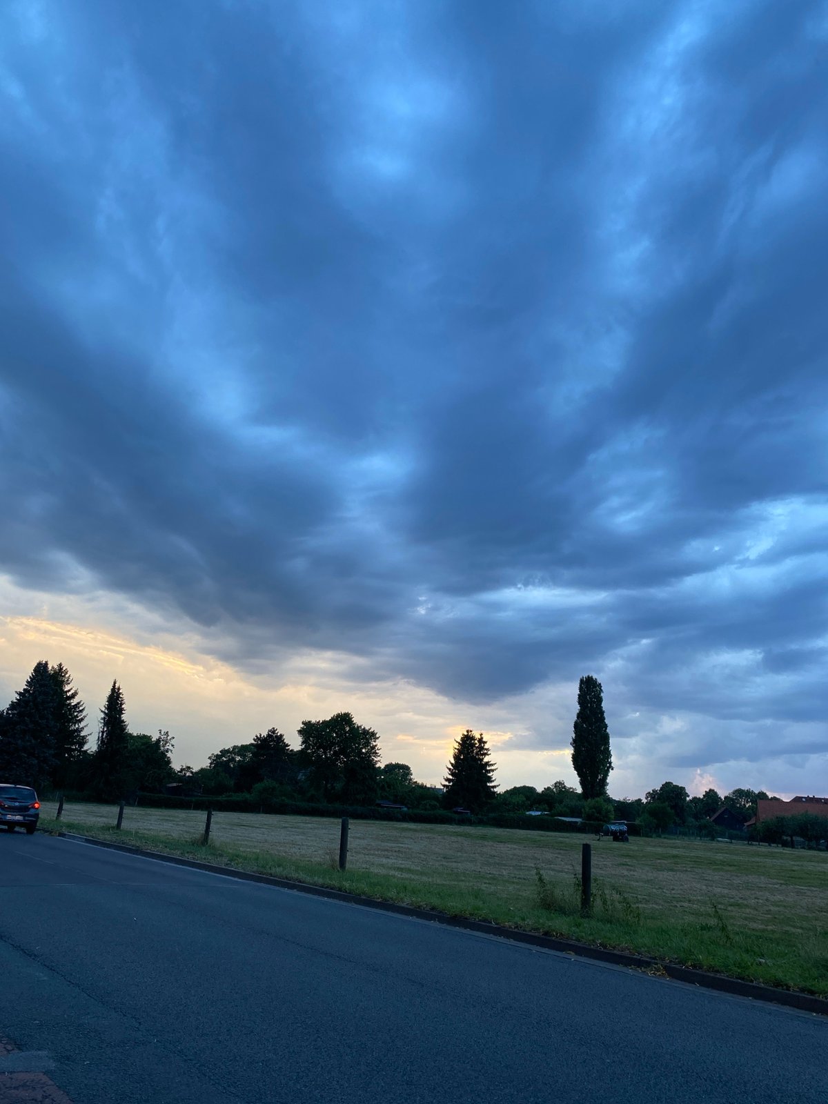 Storm clouds gather over Rinteln at dusk