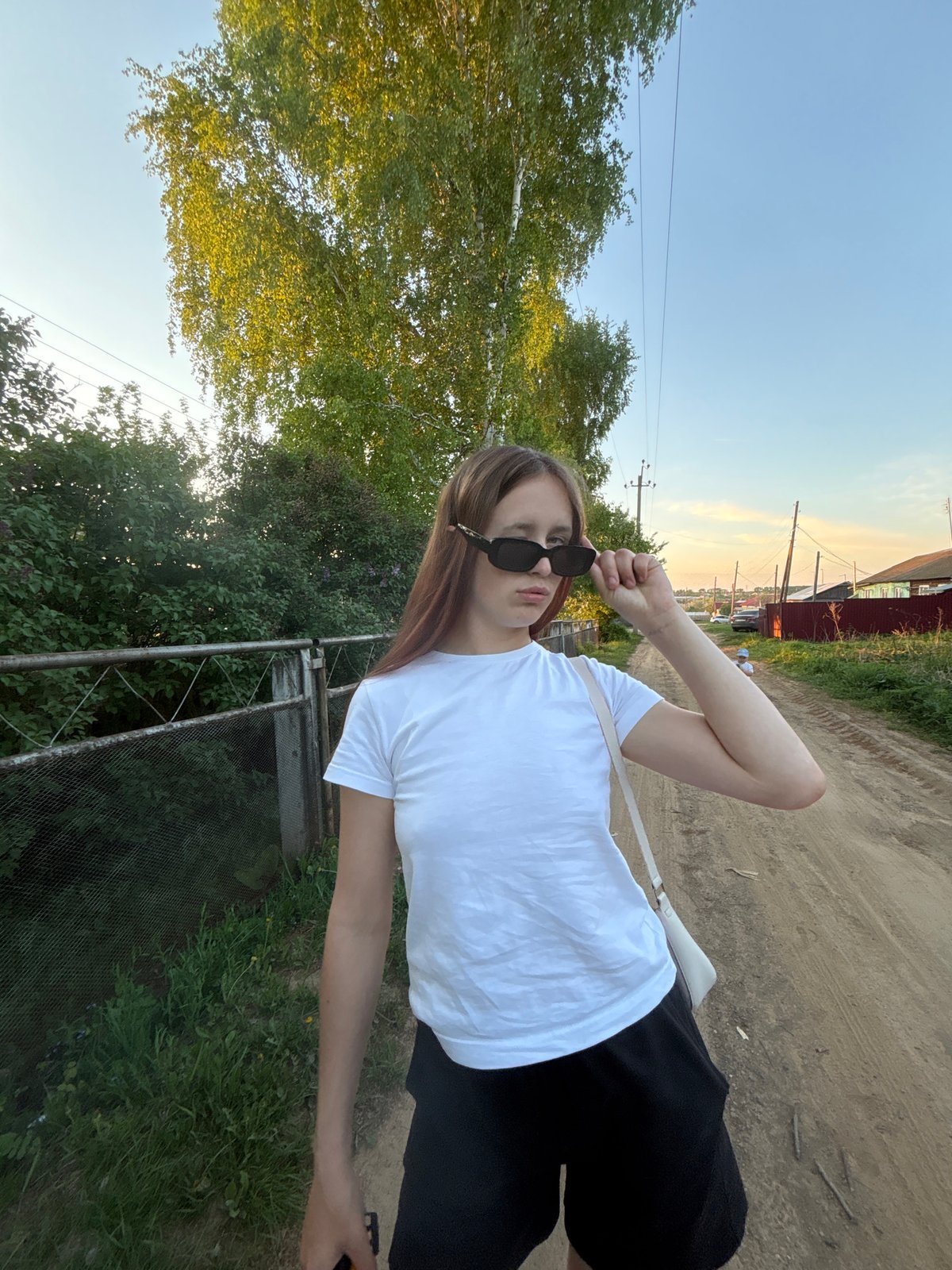 Mother and child enjoy afternoon outing in Russian village