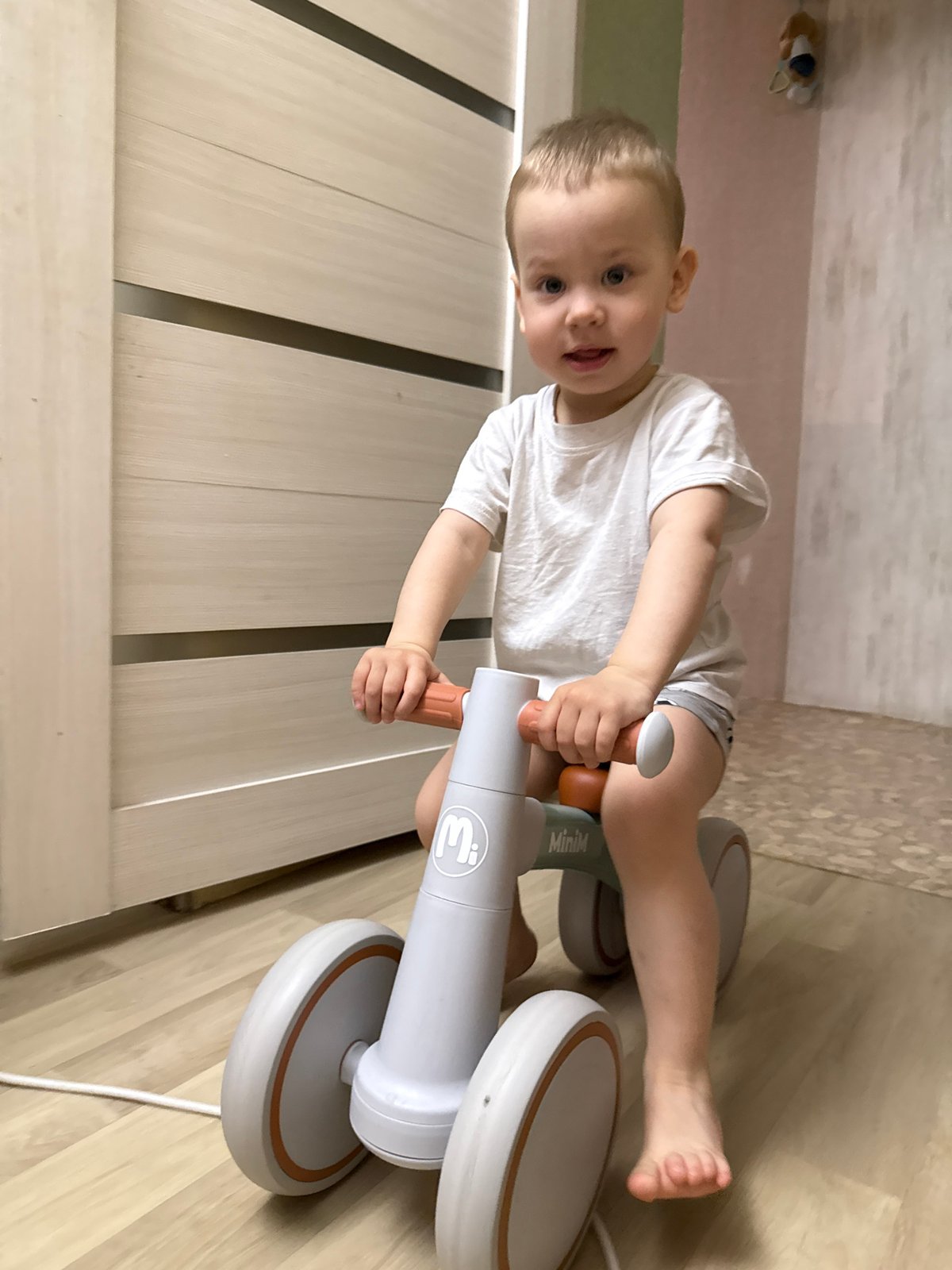 Toddler with curious expression observed indoors early Friday morning