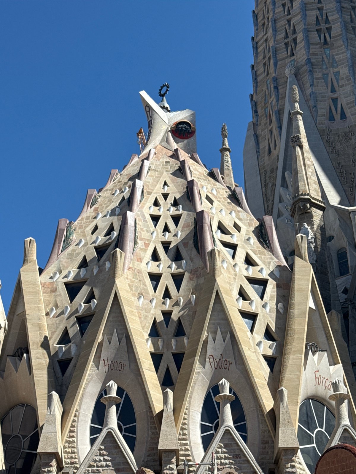 Tourists gather at Barcelona's Sagrada Familia on sunny morning