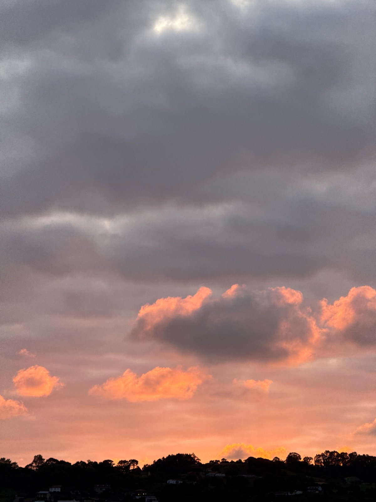 Dramatic sunset captured across Gijón's coastline and beaches