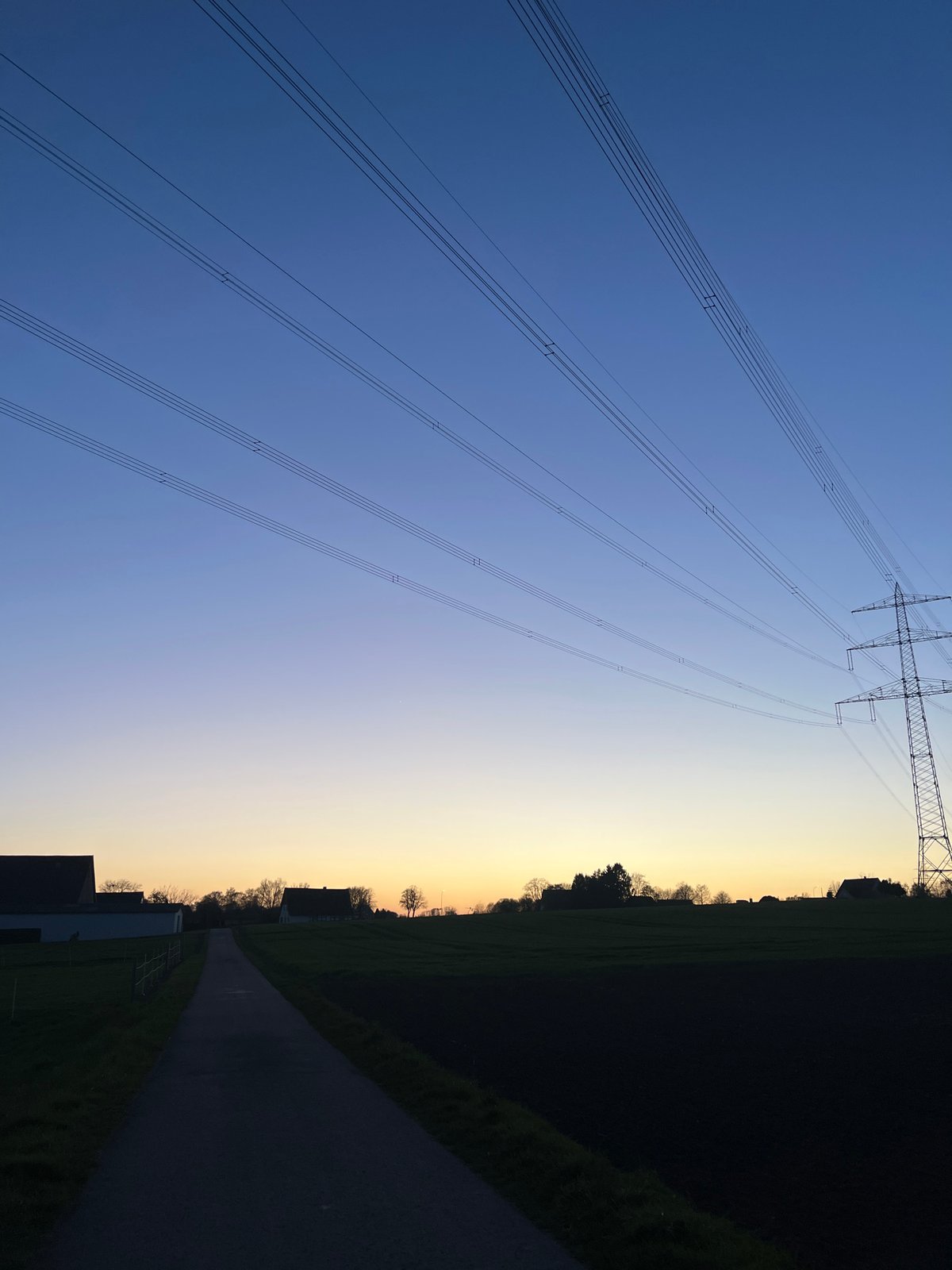 Twilight power tower scene captured in rural Herford