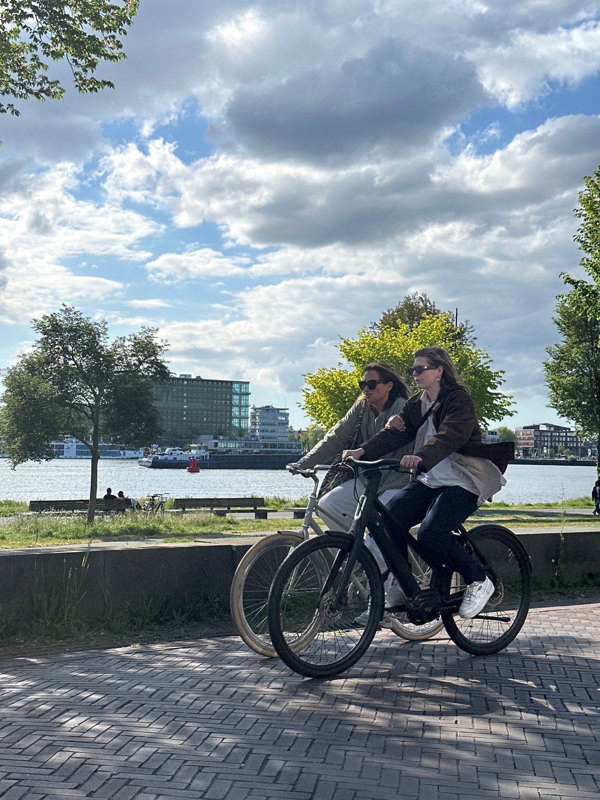 Sunny afternoon life captured along Amsterdam waterfront