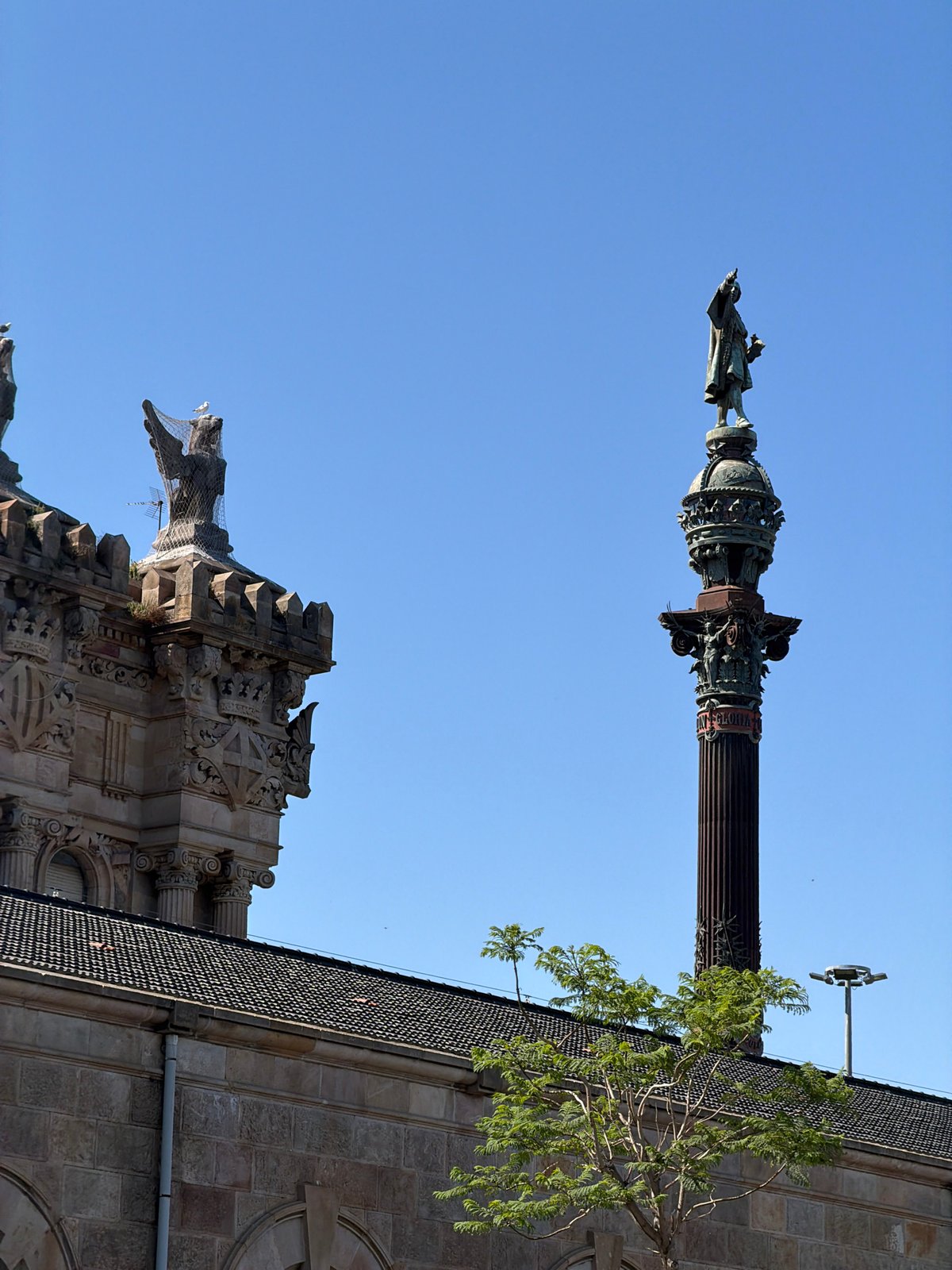 Barcelona waterfront afternoon: historic facades, cable cars, and harbor plazas