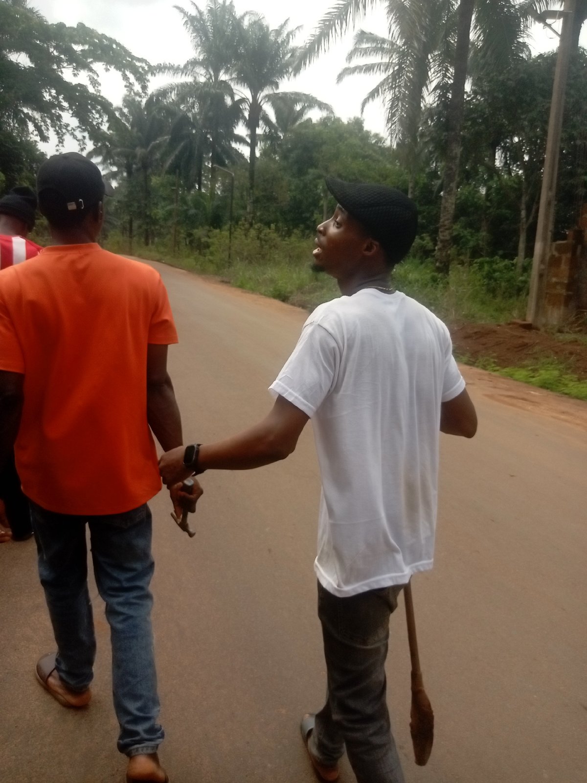 Two men conduct construction work in southeastern Nigeria