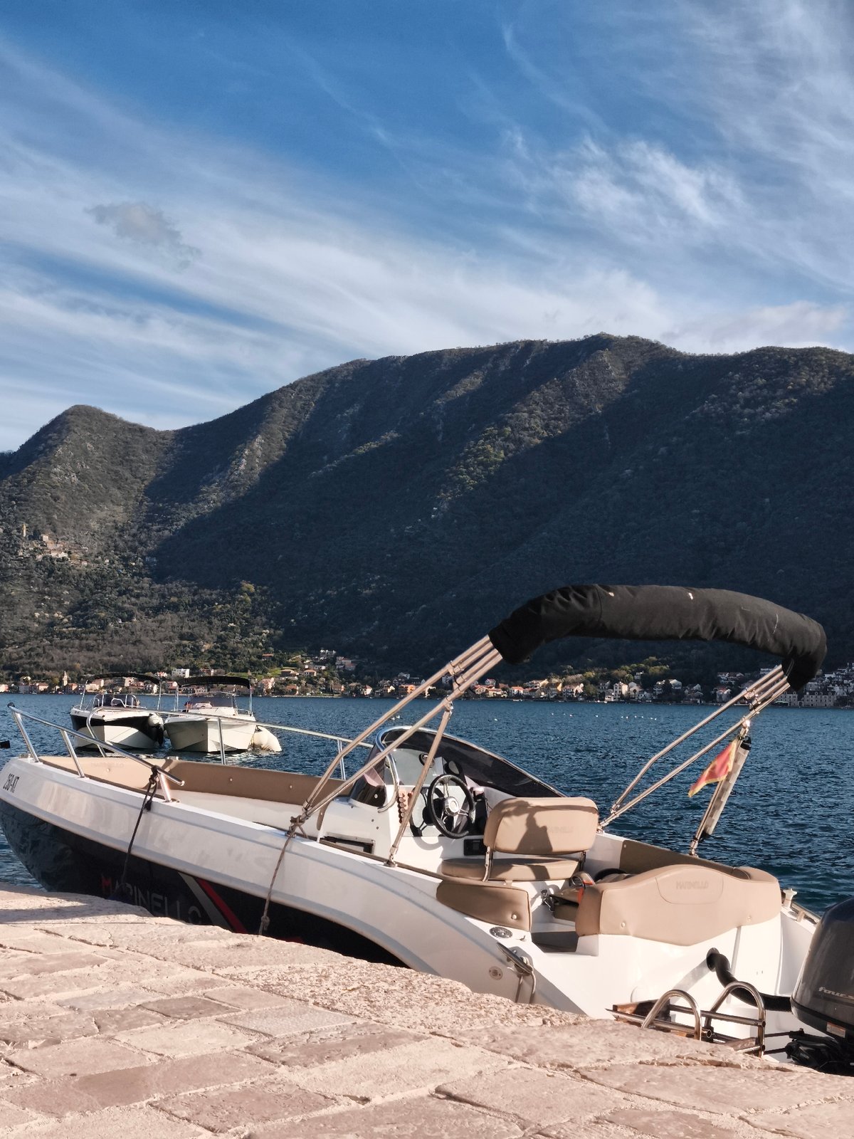 Afternoon tourist activity captured in historic Perast, Montenegro