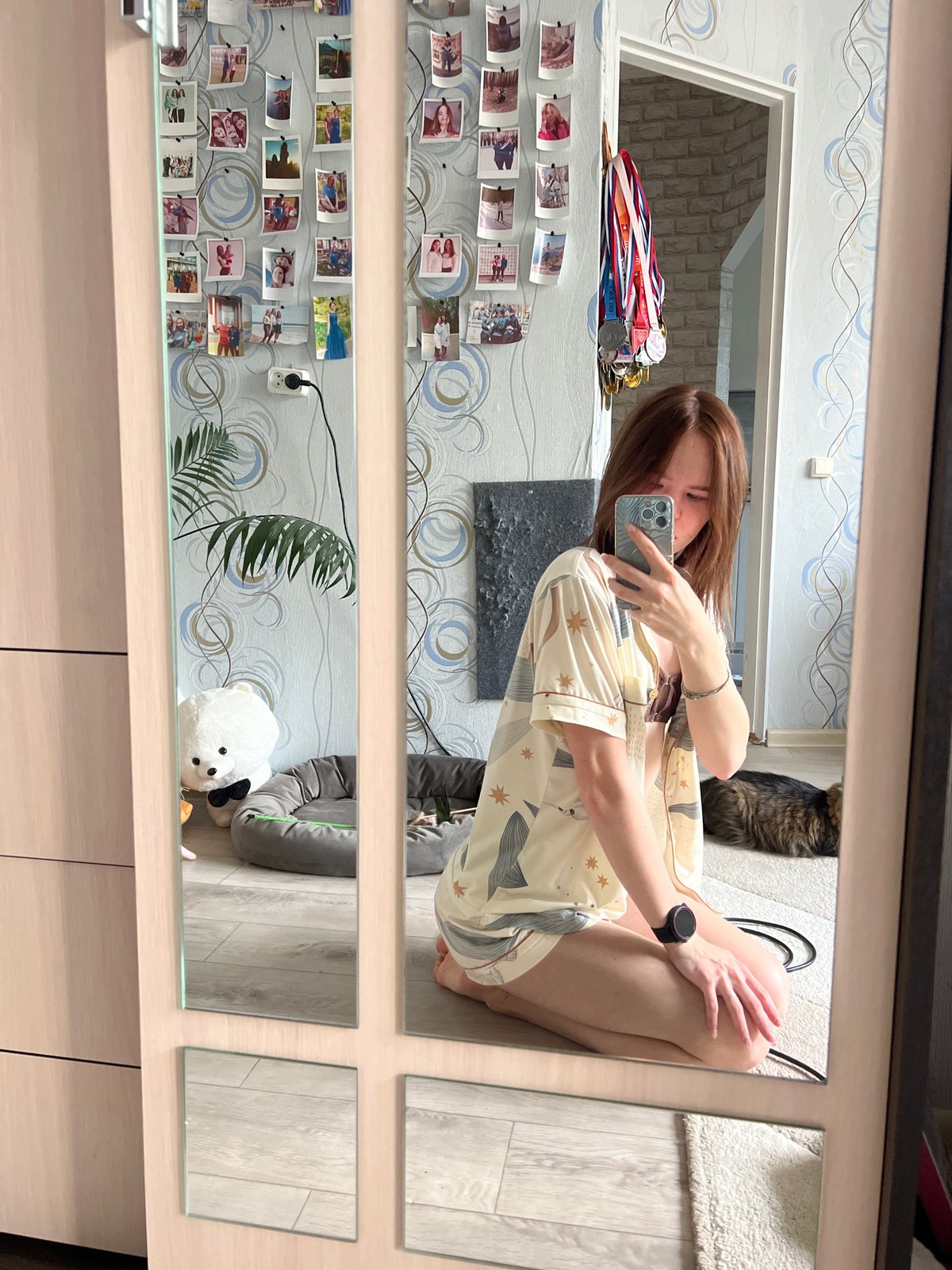 Woman documents personal moments with cat, flowers in Chaikovsky