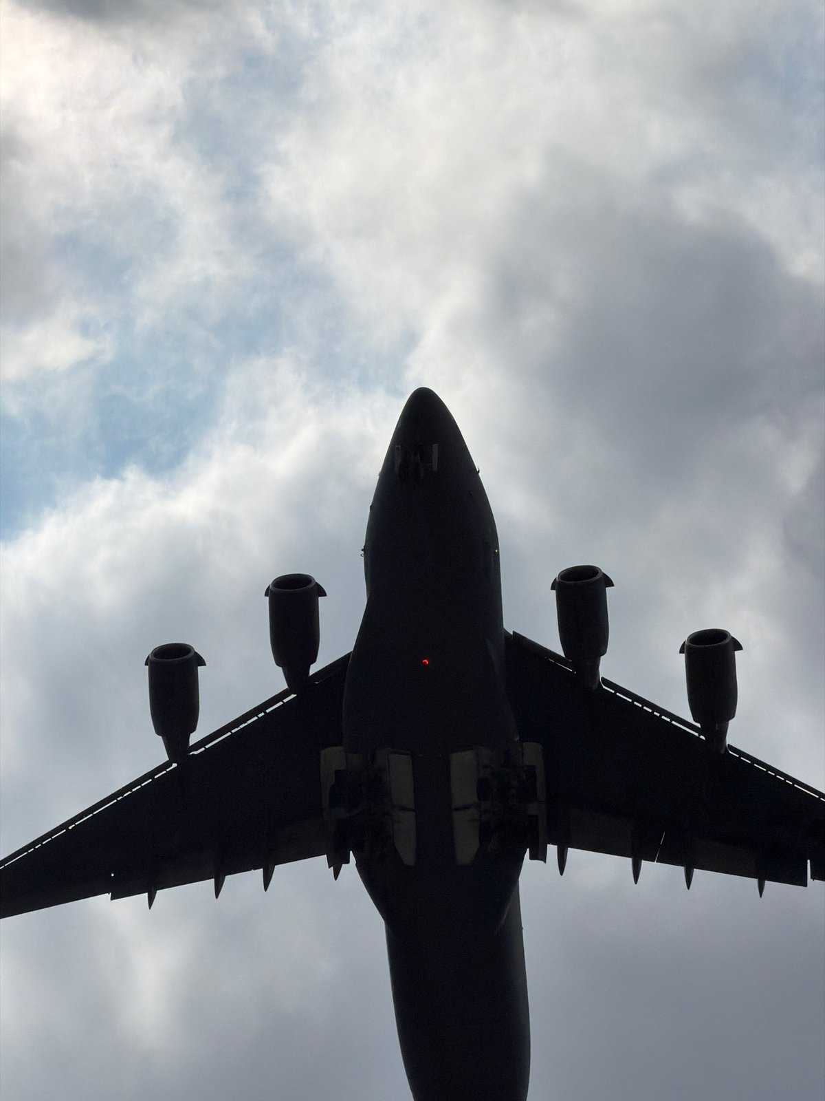 Cargo plane over Burgas and a car stripped down in a repair shop
