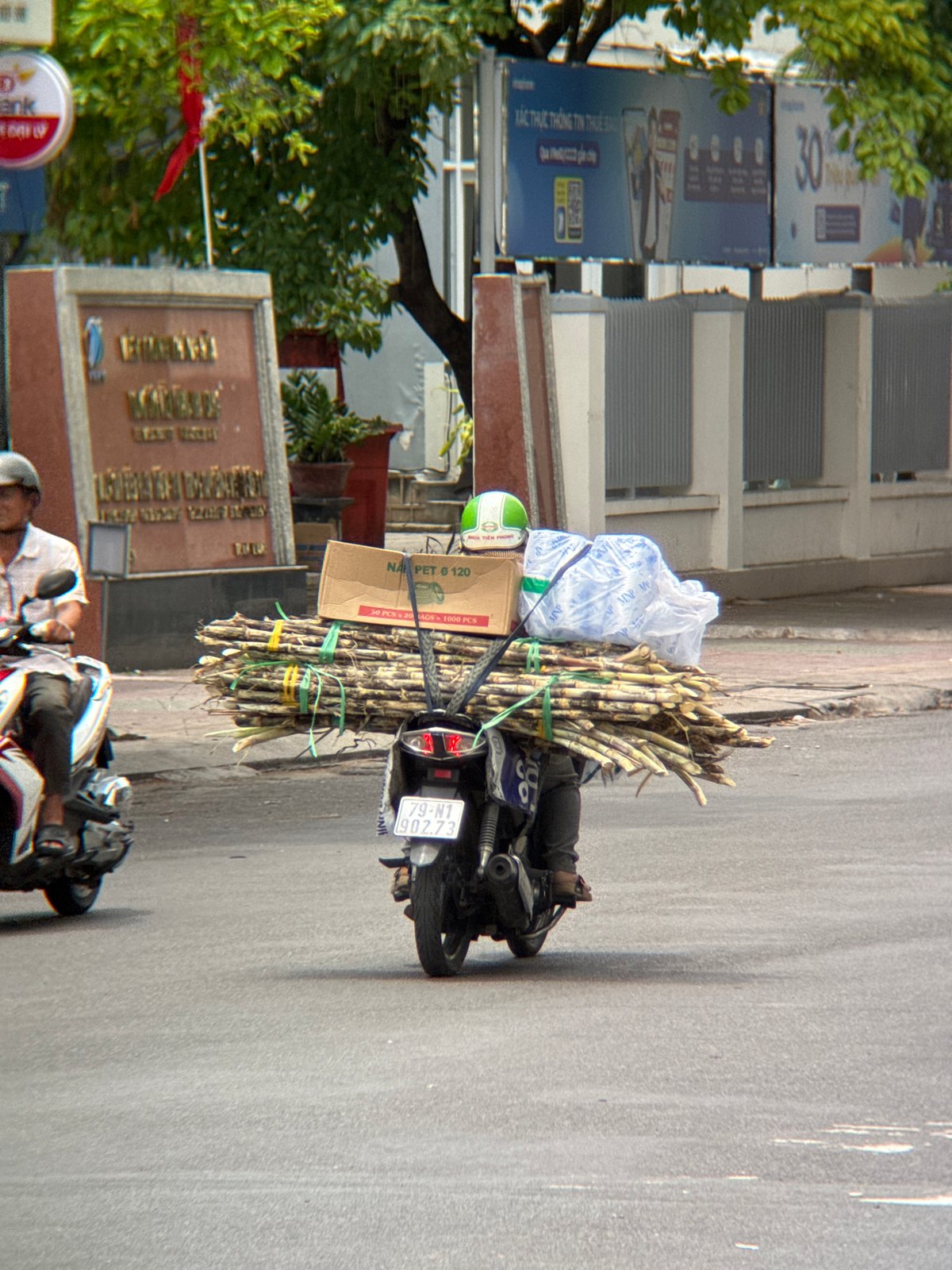 Motorbike street activity in Nha Trang, cargo and all